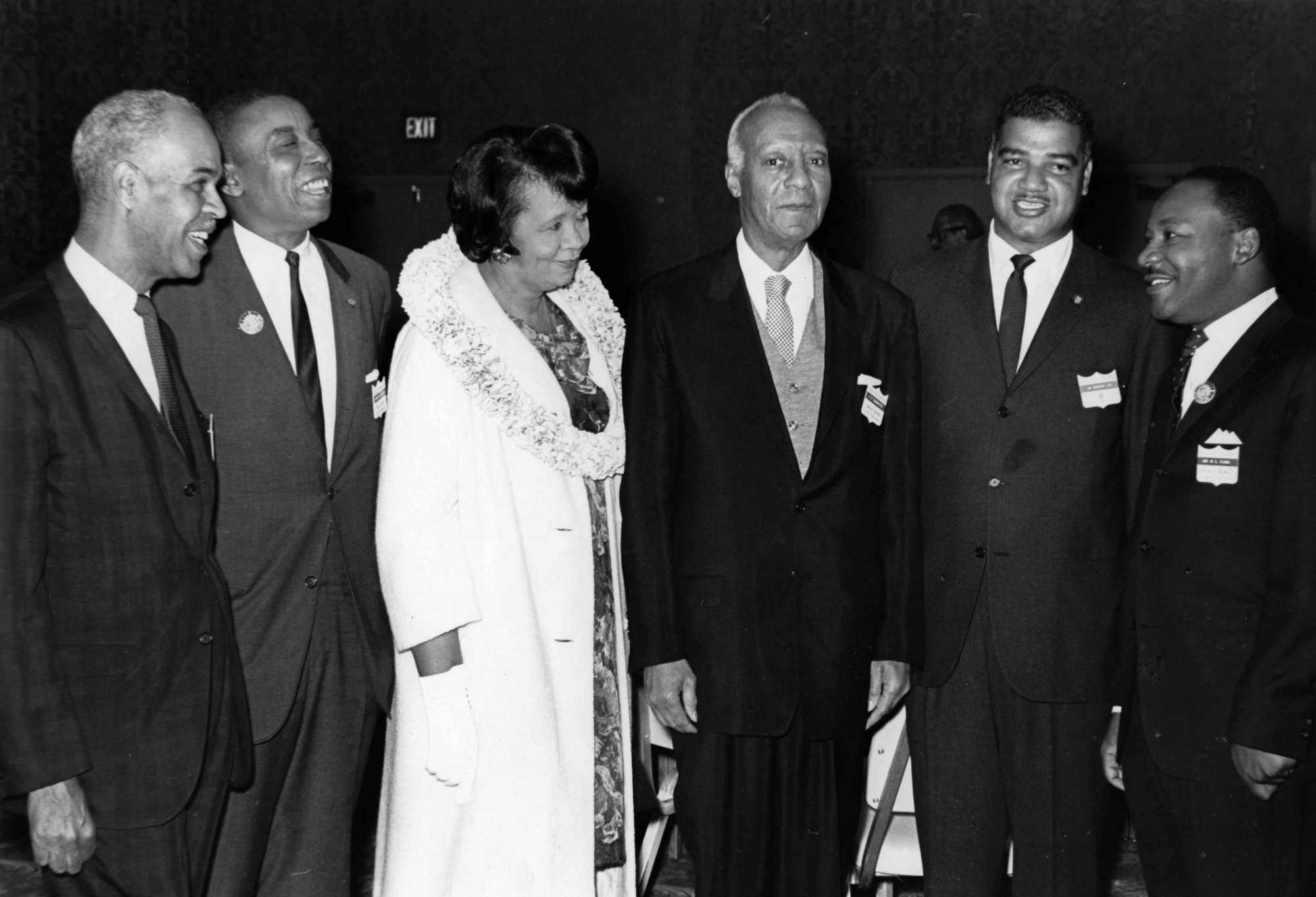 Photograph of Dorothy Height with other civil rights leaders: Roy Wilkins, Floyd McKissick, A. Philip Randolph, Whitney Young, and Rev. Martin Luther King Jr., ca. 1963