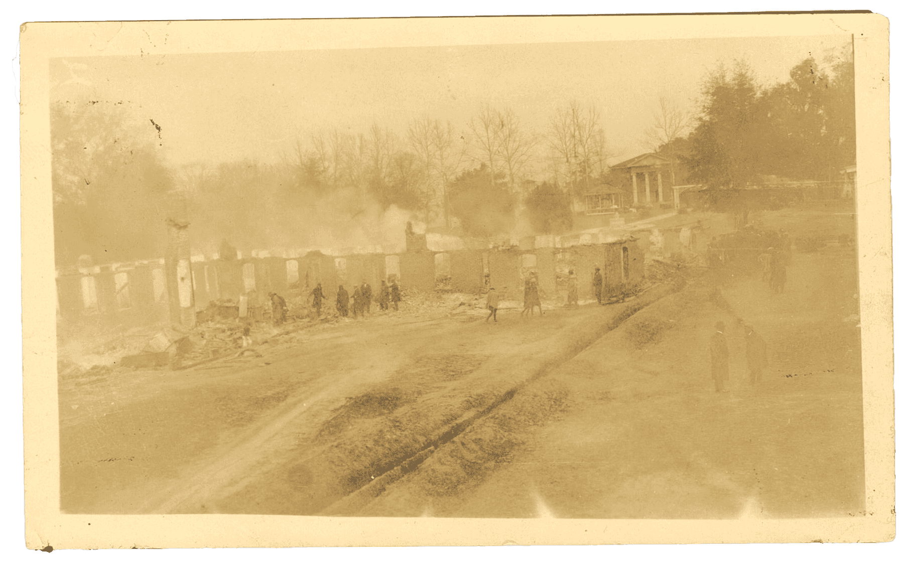 A black and white photo of burned buildings.