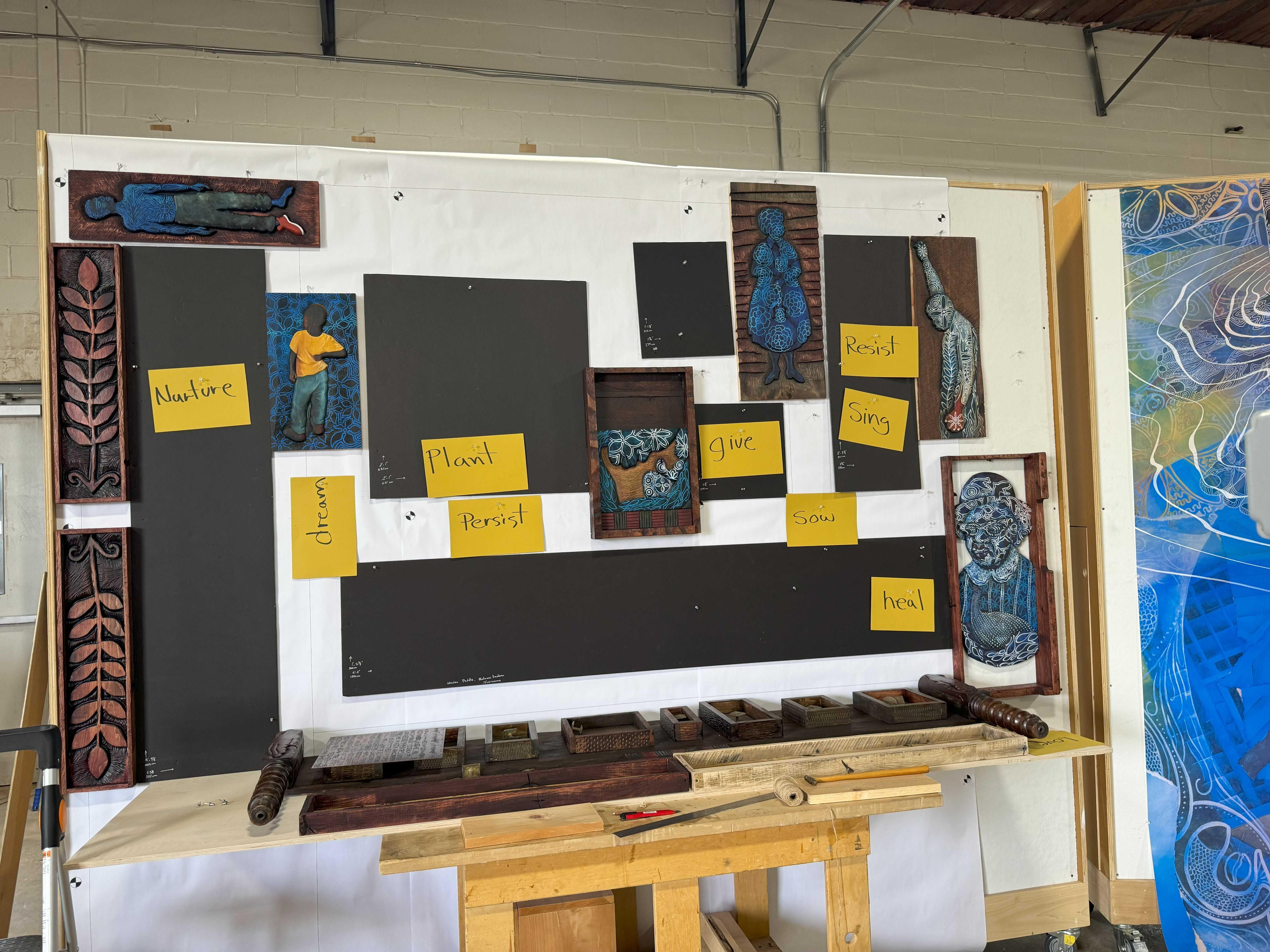Color photograph of artist studio showing installation of "Acts of Freedom-Making."