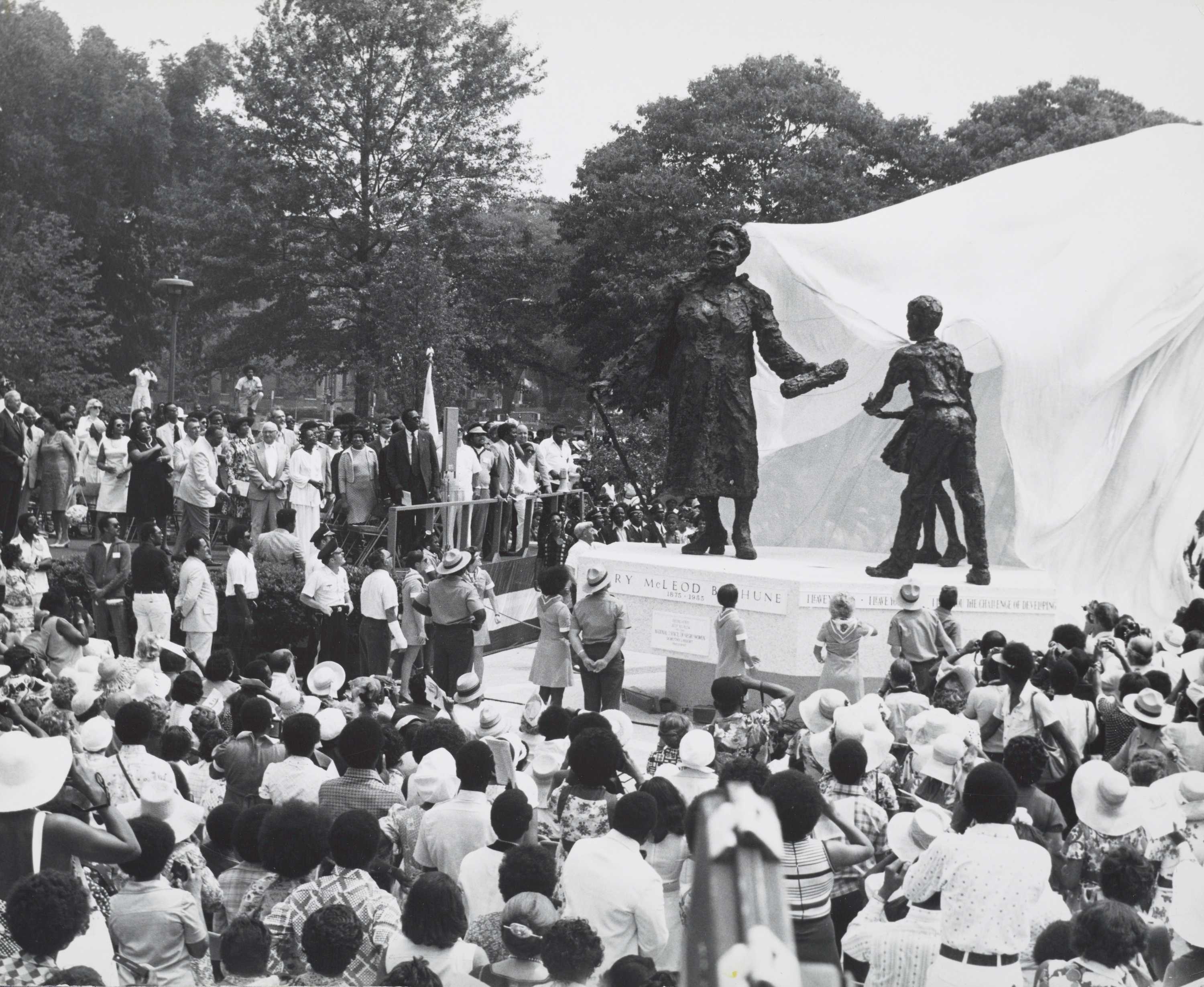 A black-and-white photograph of a large crowd of people gathered in Lincoln Park for the unveiling of a statue of Mary McLeod Bethune.