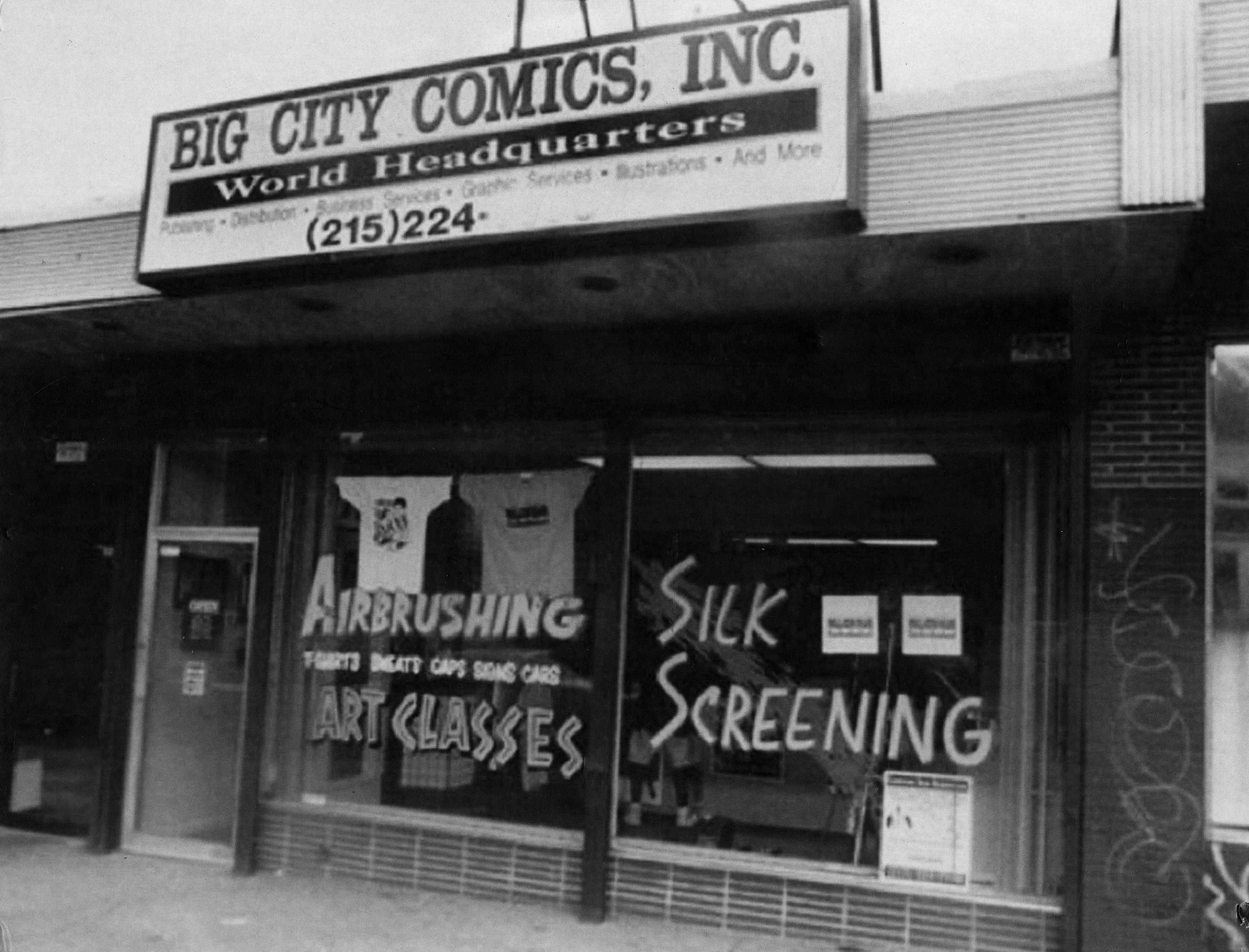 A black and white photograph of the exterior of Big City Comics.