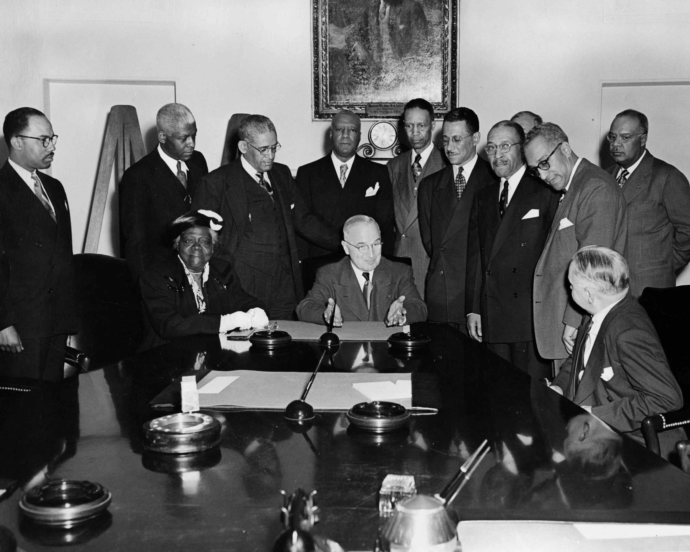 Photograph of Mary McLeod Bethune, A. Philip Randolph, and other civil rights leaders meet with President Truman at the White House