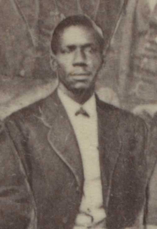 A blurry sepia tone photo of William J. Brodie. He is wearing a suit and white dress shirt.