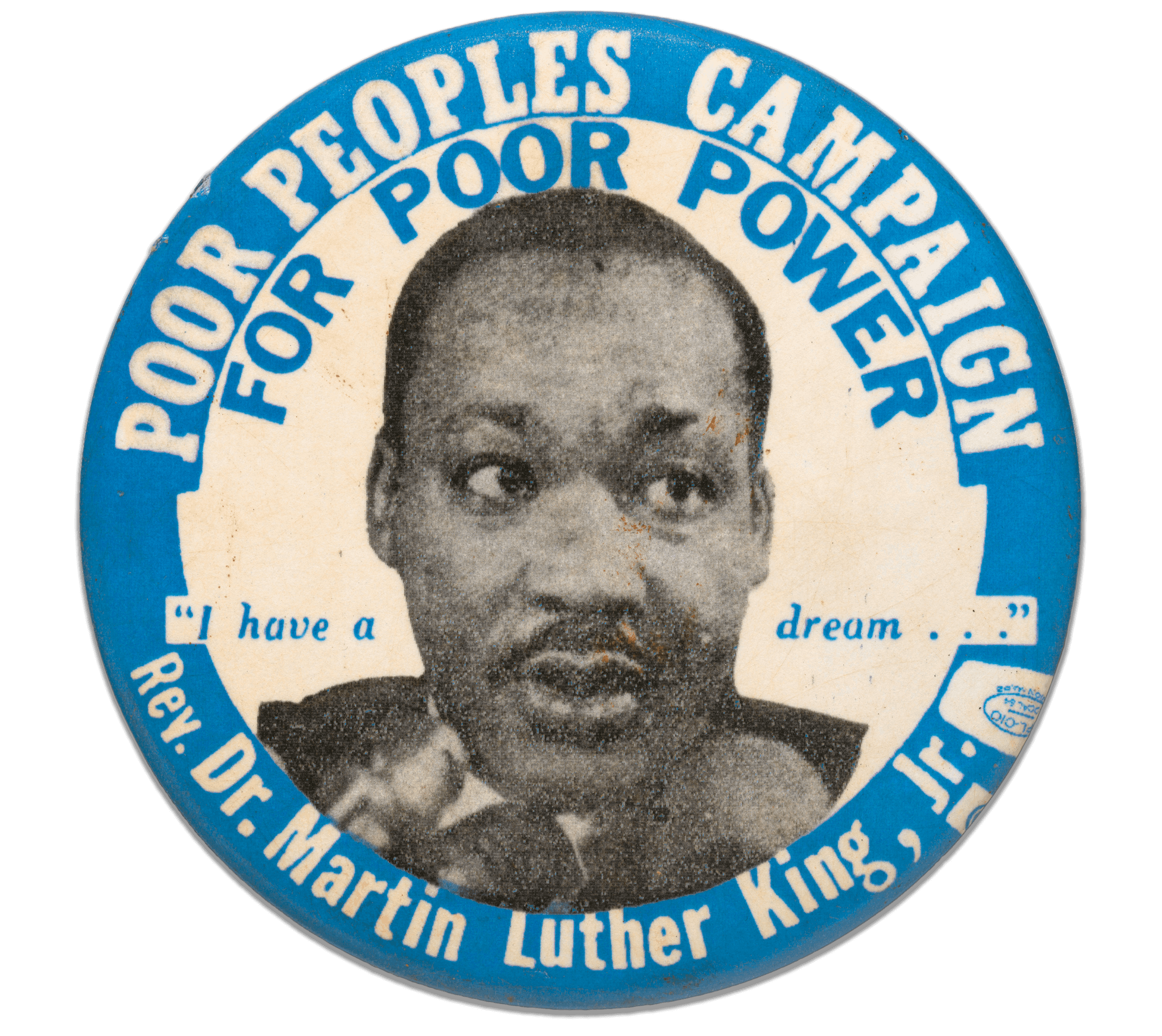A round pinback button featuring a black and white portrait of Dr. Martin Luther King Jr. in the center. Printed above and around in white text on blue background is [POOR PEOPLES CAMPAIGN], directly below in blue text on white background is [FOR POOR POWER]. In the center, divided by the portrait are the words ["I have a dream..."] in blue text. Below the portrait, in white text on blue background is [Rev. Dr. Martin Luther King, Jr.], followed by a union printer's symbol.