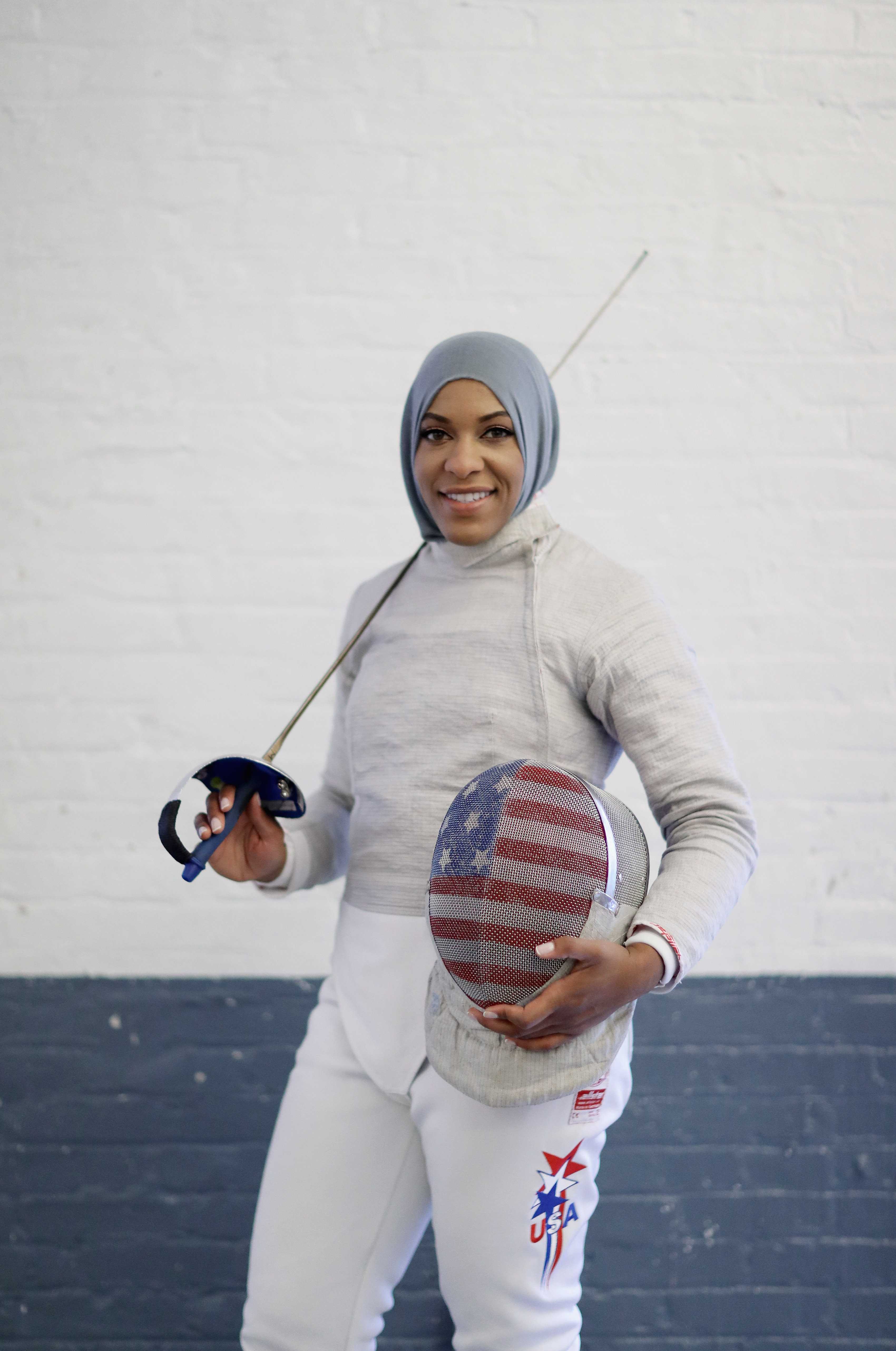 Color photograph of woman in fencing uniform