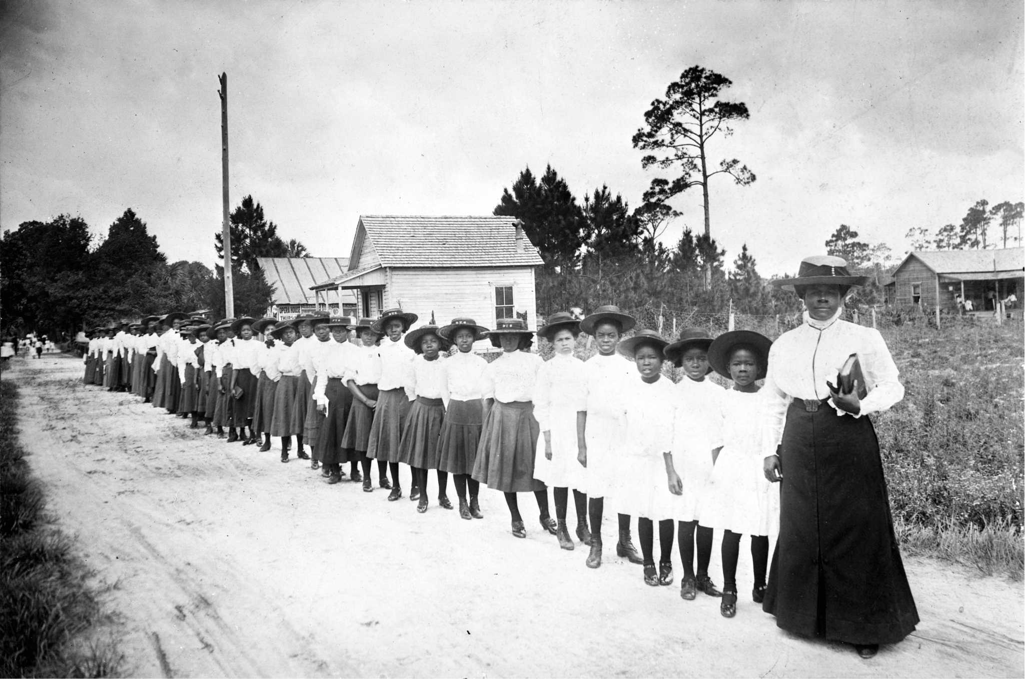 Photograph of Mary McLeod Bethune with students from the Daytona Institute