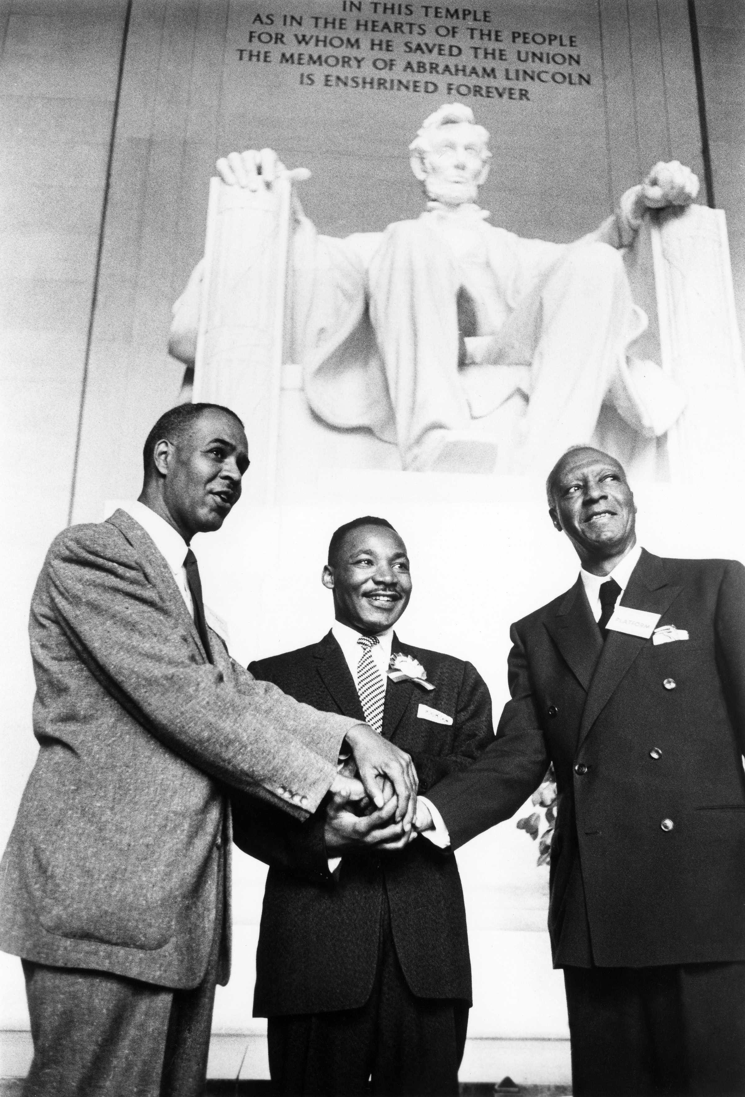 Photograph of Roy Wilkins, Martin Luther King Jr., and A. Philip Randolph in front of the Lincoln Memorial