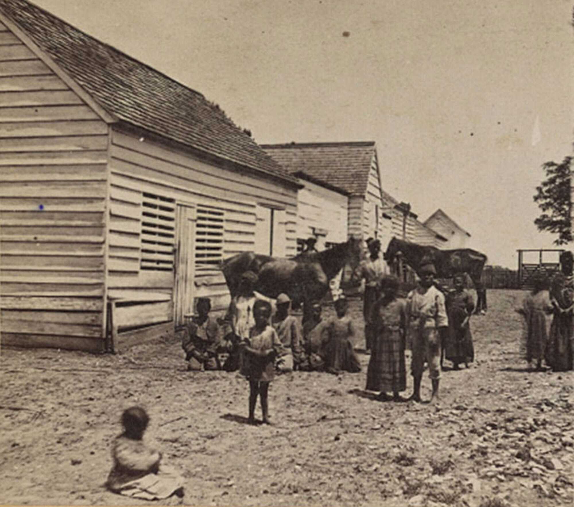 Photograph of enslaved persons with children