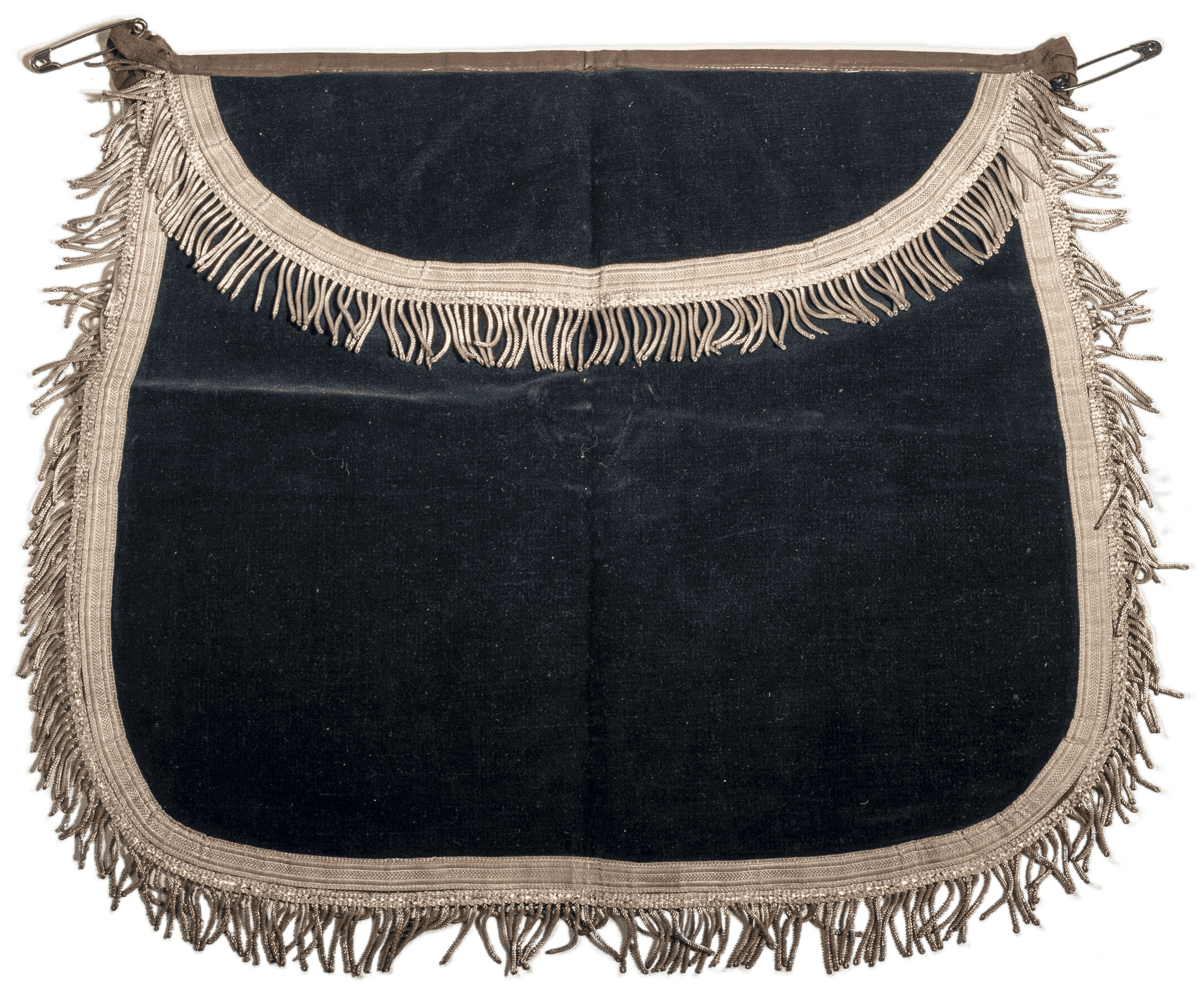 Blue apron decorated with a cream color fringed trim.  THere are two safety pins holding the brown apron strings.