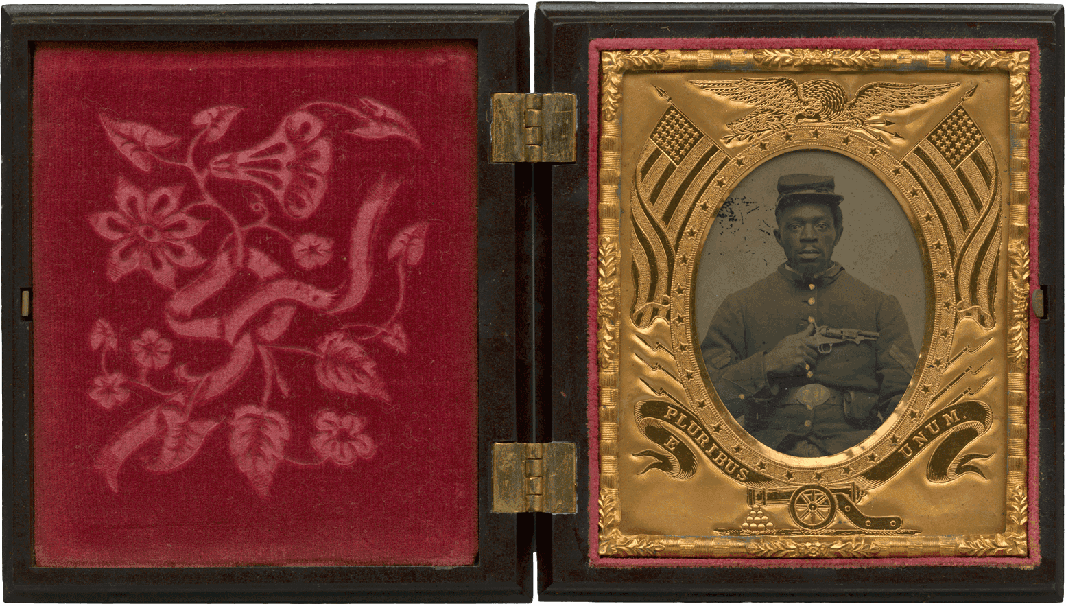 A tintype of a soldier with his portrait on the right hand side and a red velvet flower pattern on the right.