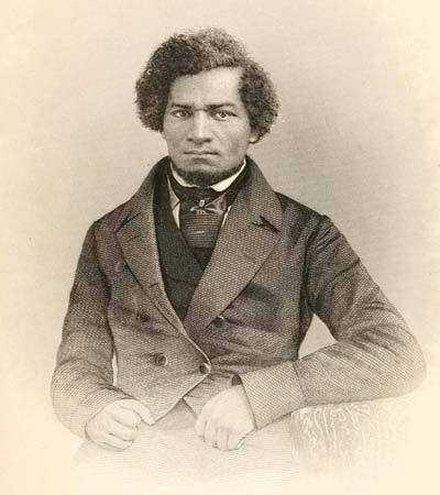 A black and white portrait of Frederick Douglass dressed in a dark color suit and necktie.
