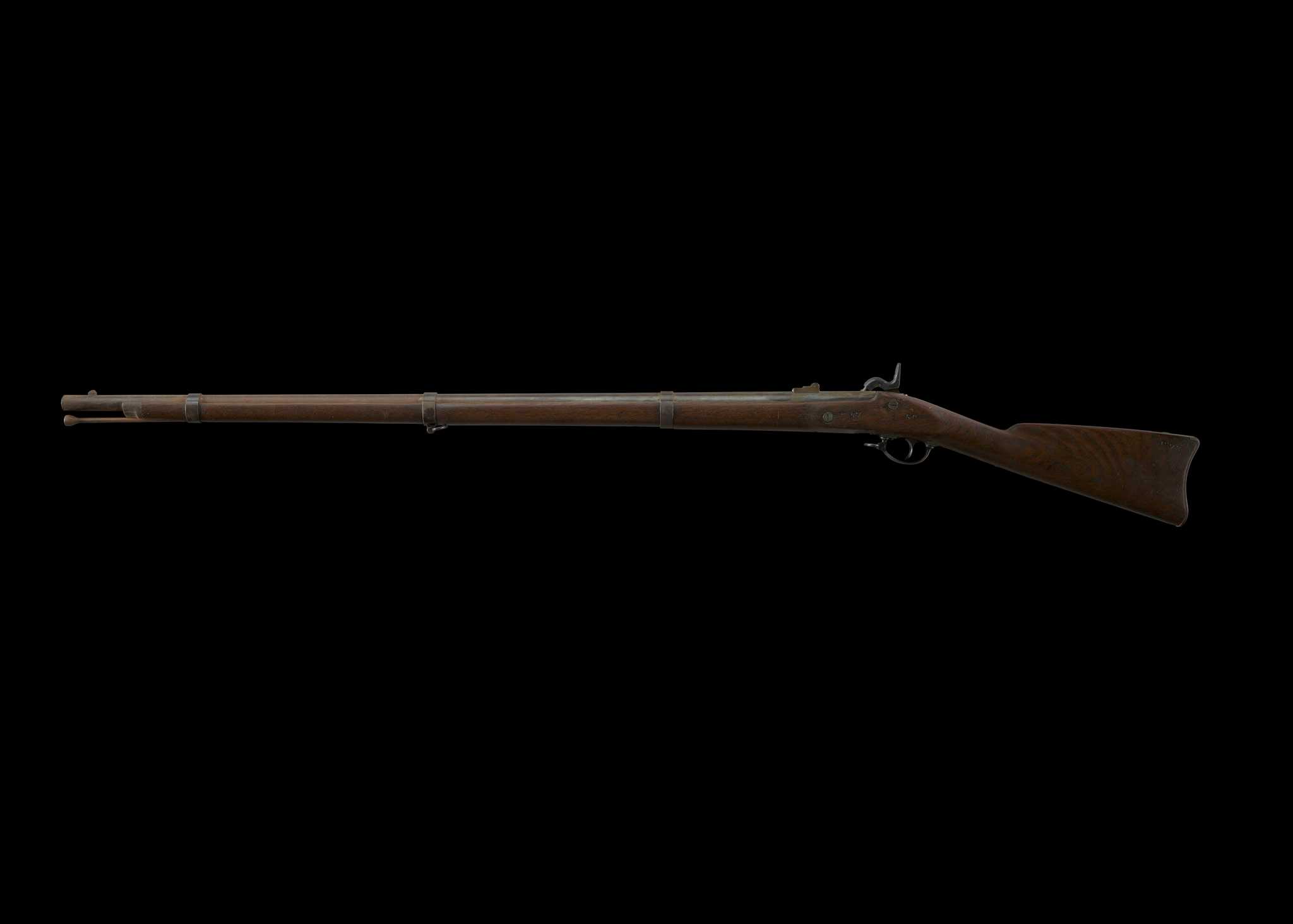 A U.S. Model 1861 .58 caliber rifle musket produced by William Muir & Company for use by the Army and Marine Corps during the American Civil War. The rifle is constructed of a walnut stock, steel barrel, barrel bands, front and rear sights, stored ramrod and fittings. The barrel bands are engraved with a “U” on their undersides. The top of the barrel bear the hammer bears a dated engraving, “1863”, parallel (on the barrel’s proper left) to which are manufacturer proof marks “V/P”. A “47 / 50” is stamped along the proper left stock parallel to the barrel’s date and proof marks. A “58” is stamped along the top of the breech, adjacent to the hammer. The proper right lock plate features an engraved eagle and manufacturer’s identification: [U.S. / WM MUIR & CO. / WINDSOR LOCKS,CT.]. Close to the butt screw, at edge of its extended plate, is a “US” engraving. The year “1873” is engraved along the stock near the butt.