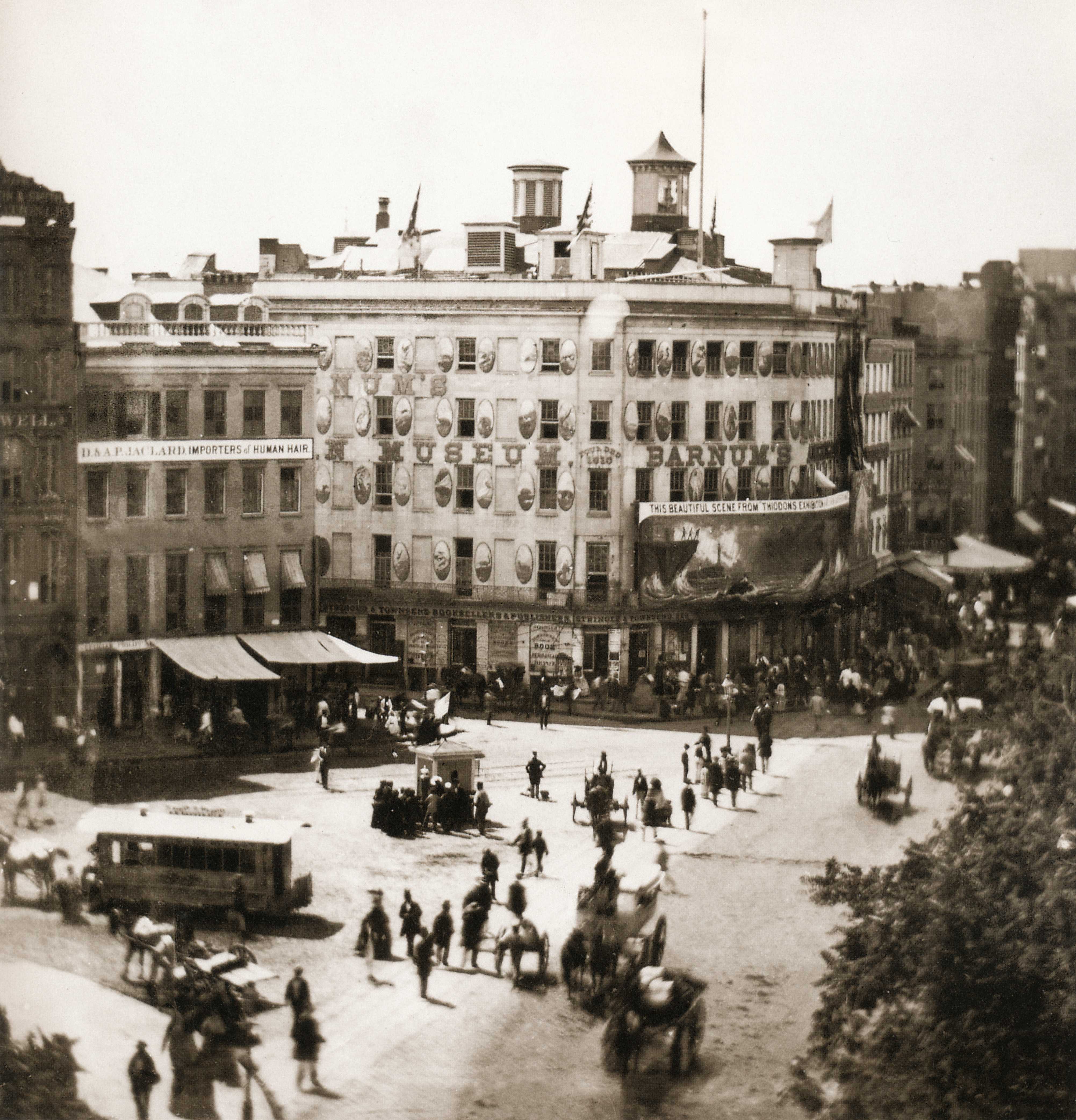 Black and white photograph of PT Barnum Museum on a busy street