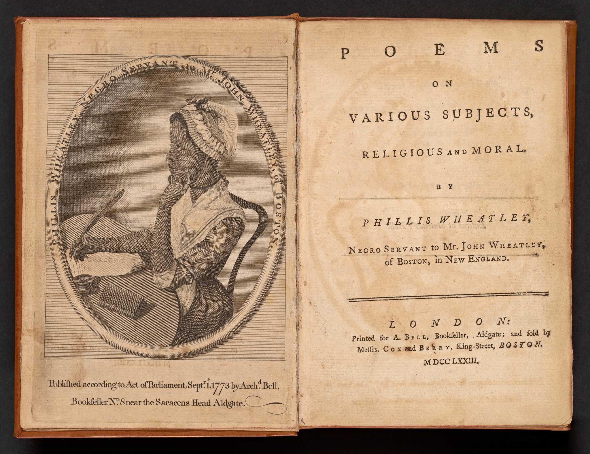 A first edition of the book Poems on Various Subjects, Religious and Moral, by Phillis Wheatley, while she was enslaved to Mr. John Wheatley of Boston. The book has a brown leather cover, the original morocco spine label, and a frontispiece featuring a portrait of Wheatley by Scipio Morehead. Along the top of the portrait are the words [PHILLIS WHEATLEY, NEGRO SERVANT TO MR. JOHN WHEATLEY OF BOSTON]. The book also has the armorial bookplate of Daniel P. Griswold, a small circular ticket from the Library of George W. Brinely, as well as a larger one from Henry Weston Sackett.