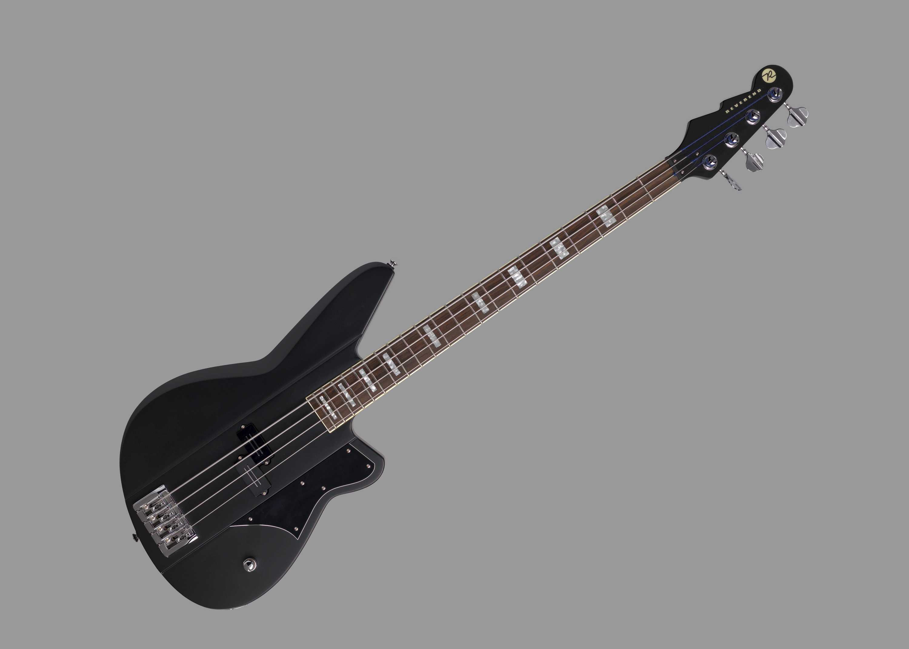 Meshell Ndegeocello's Bass's is black. It is suspended in front of a grey background.