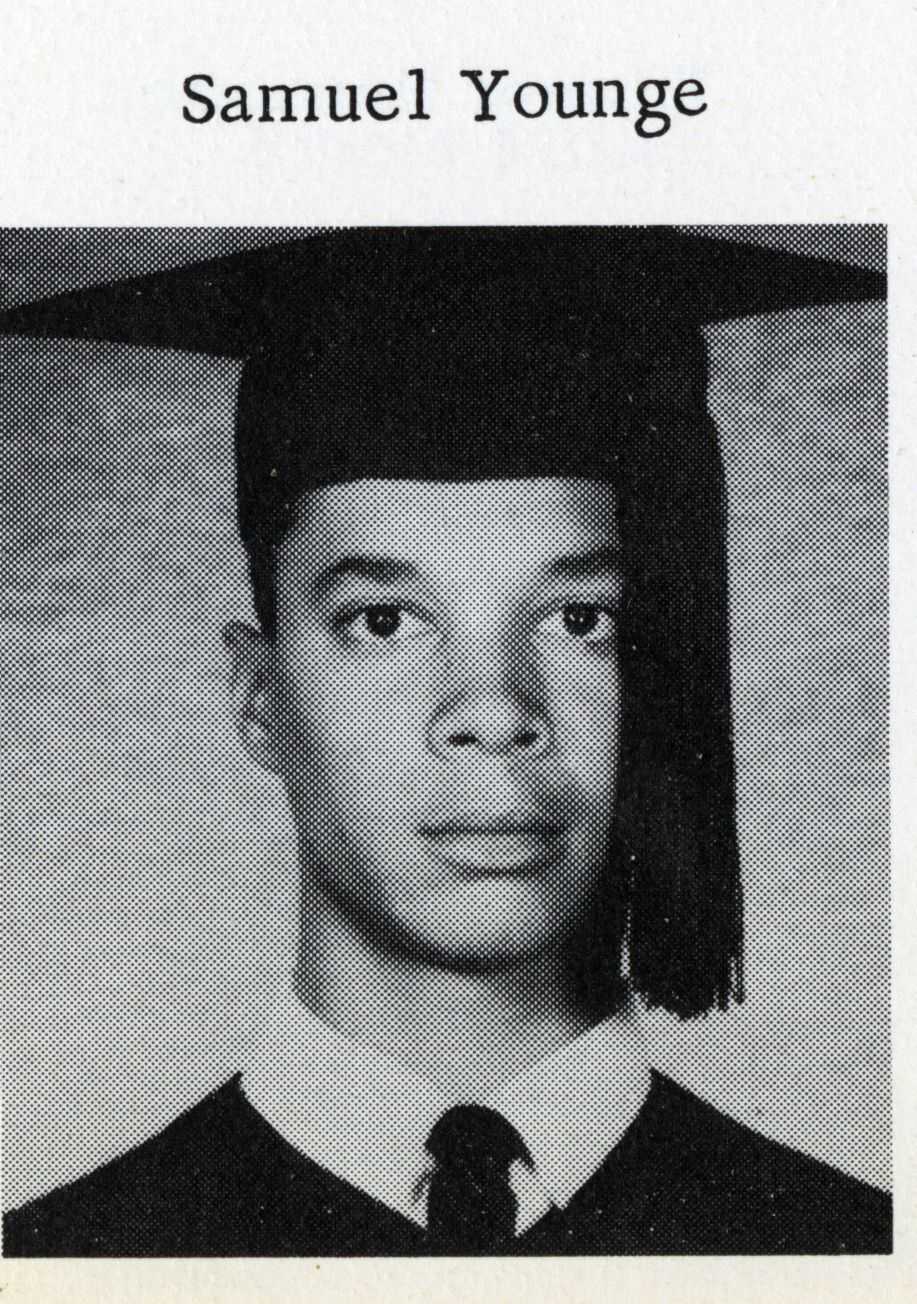 Black and white yearbook photo of Sammy Younge pictured in cap and gown.
