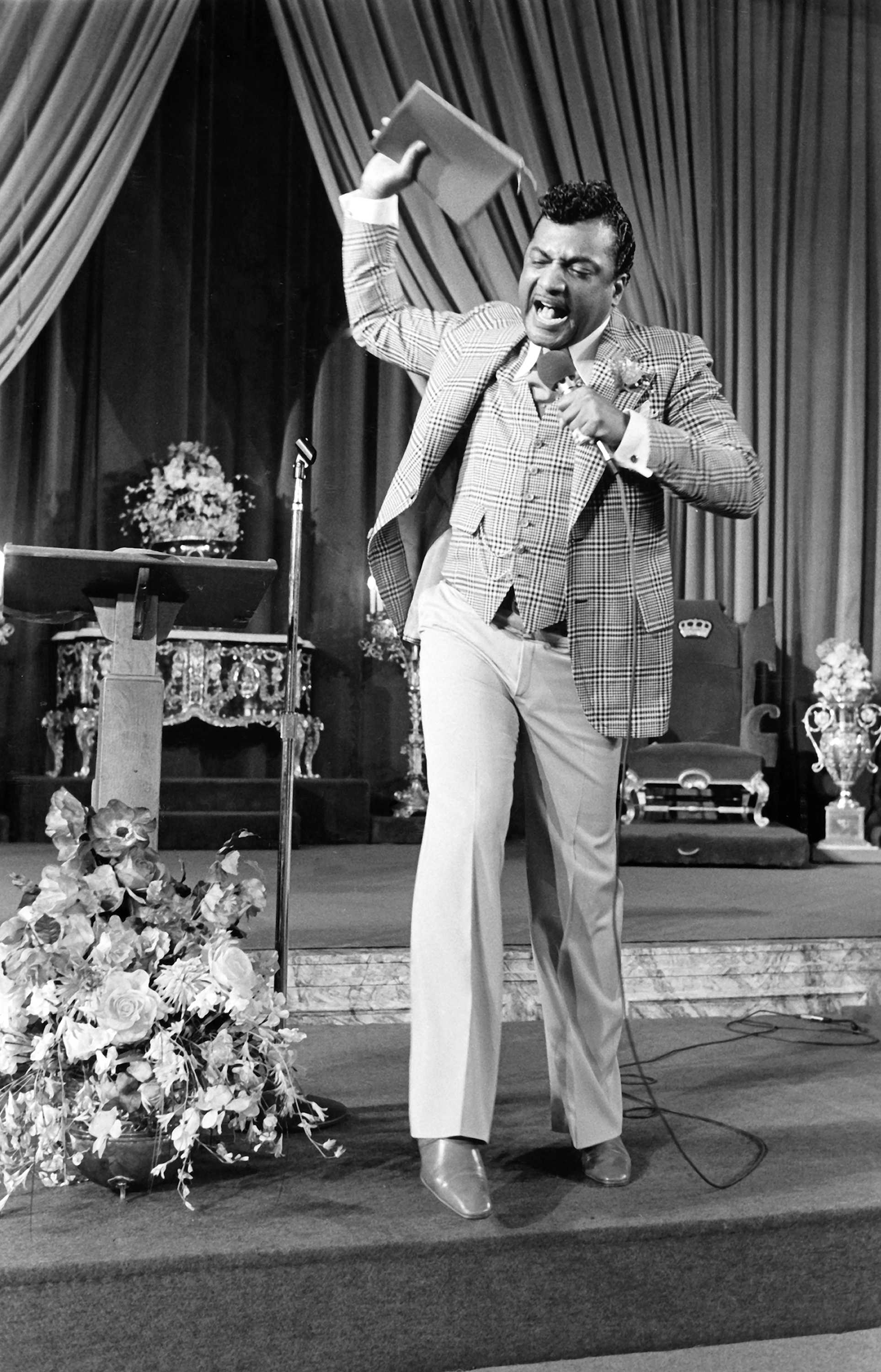 Black and white photograph of Reverend Ike preaching in the United Church in Washington Heights, New York, New York