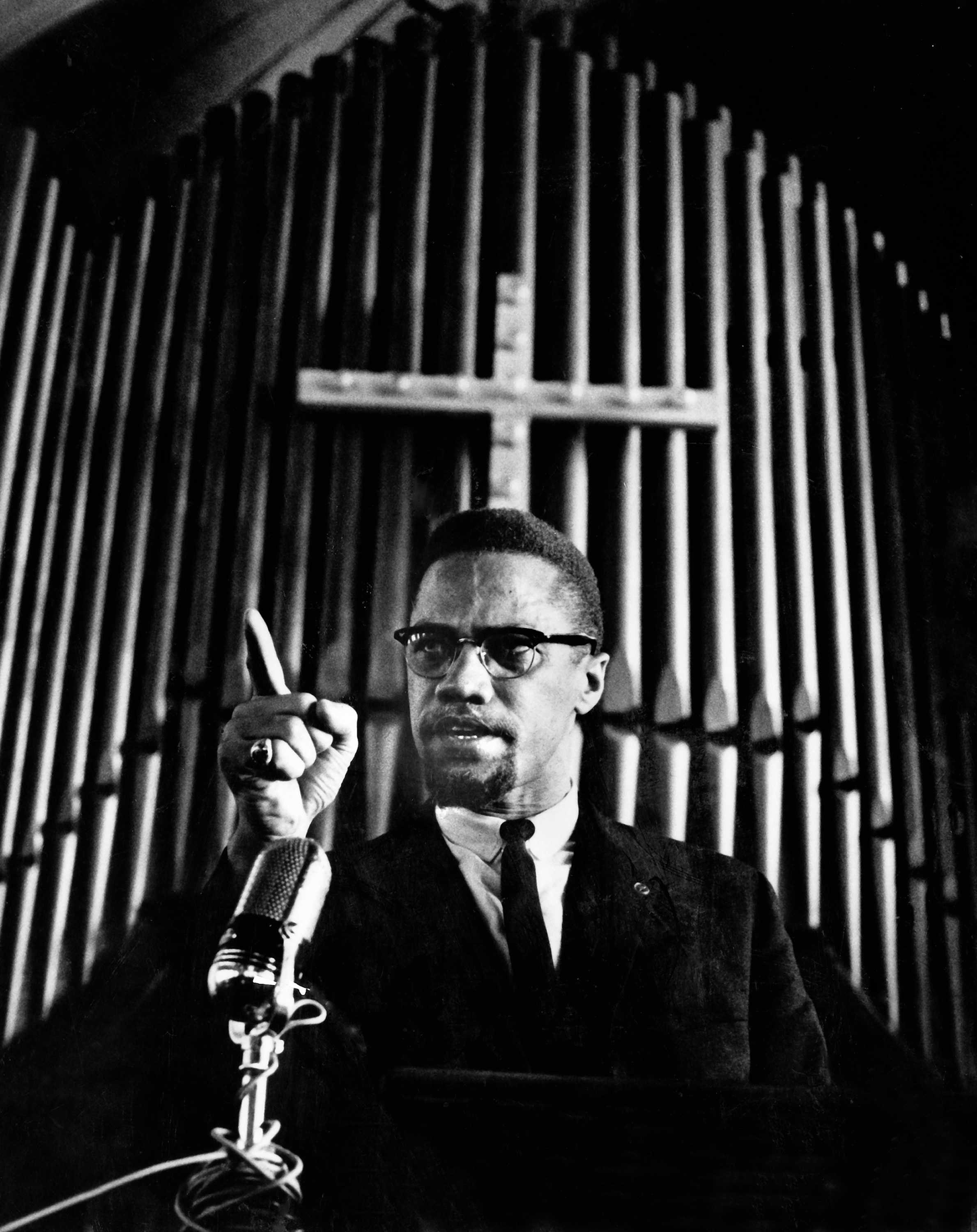 Black and white photograph of Malcolm X addressing a mass meeting at Brown Chapel AME Church, Selma, Alabama