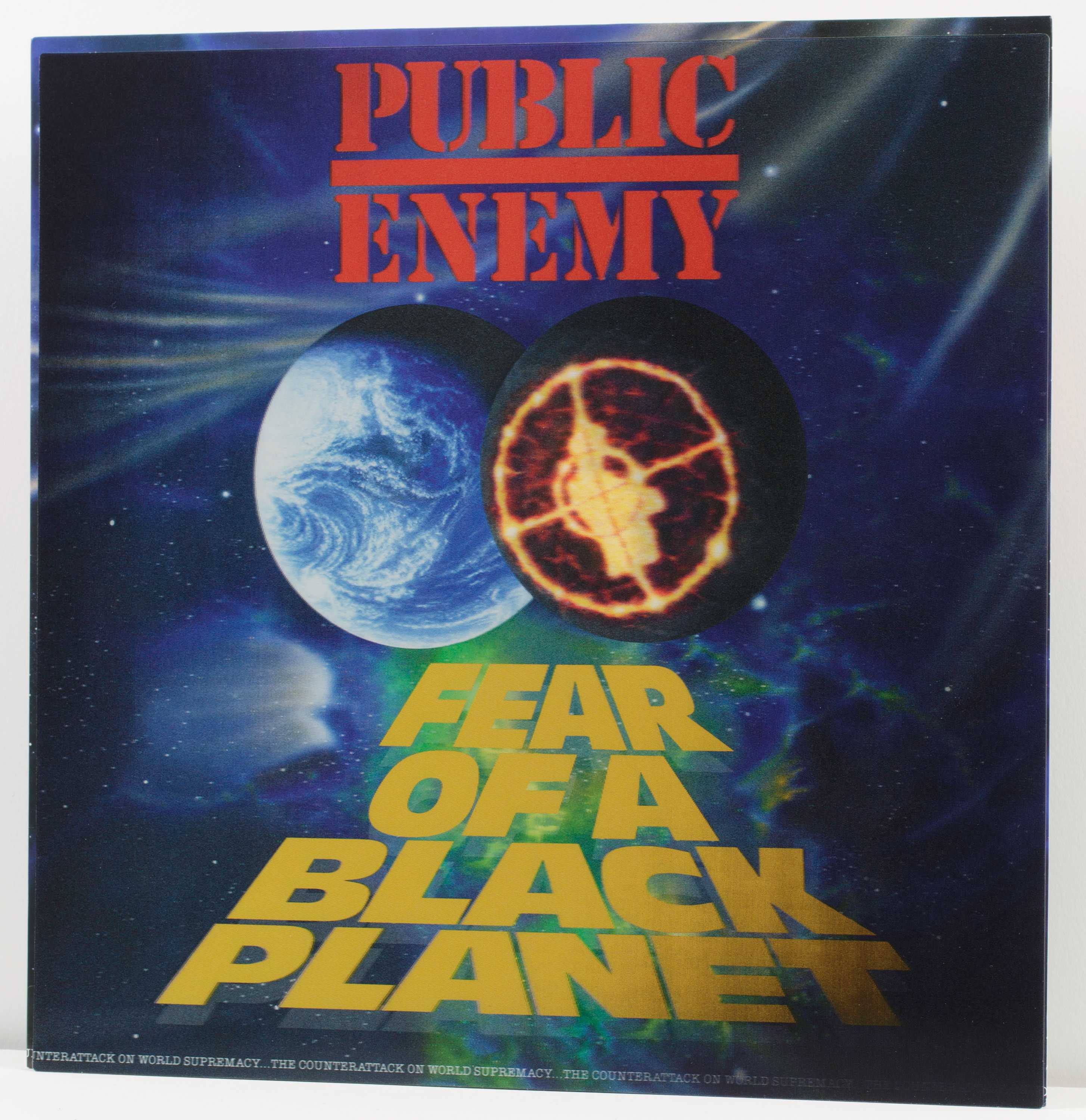 Black Planet album art has two planets colliding in space with the 'Fear of a Black Planet' in bold yellow font below.