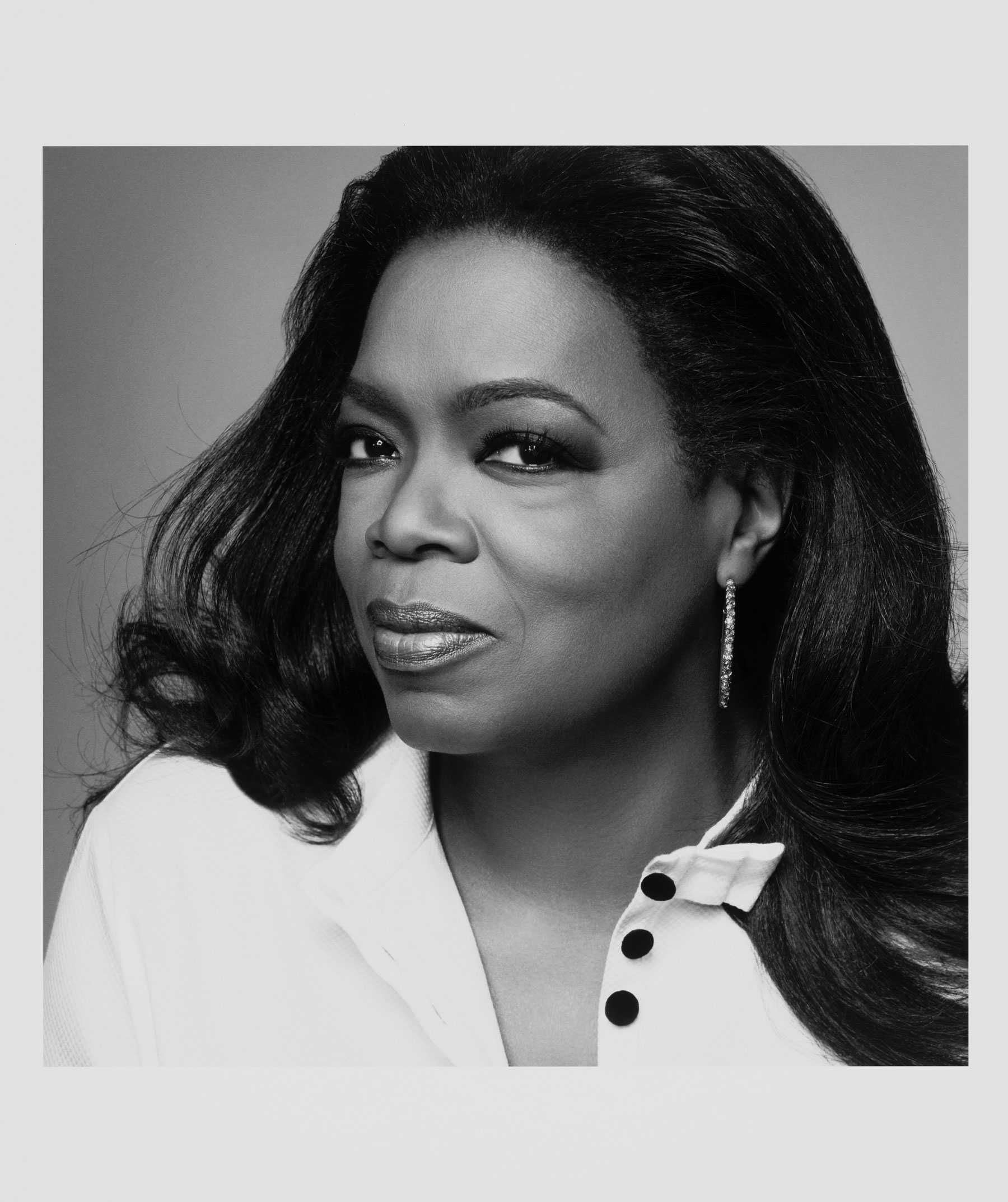 Black-and-white portrait of a woman looking at the camera.