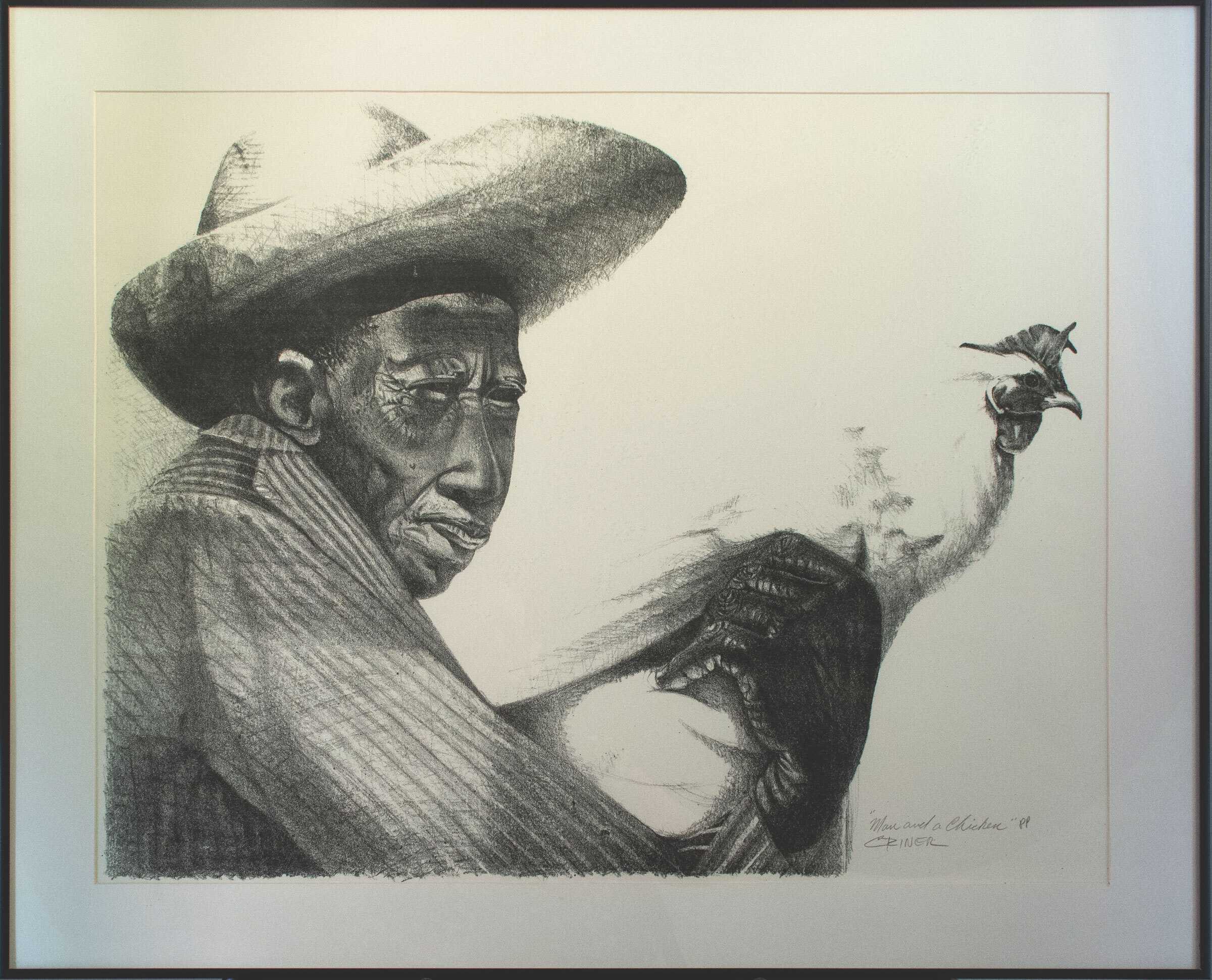 Framed artwork depicting a man holding a chicken.