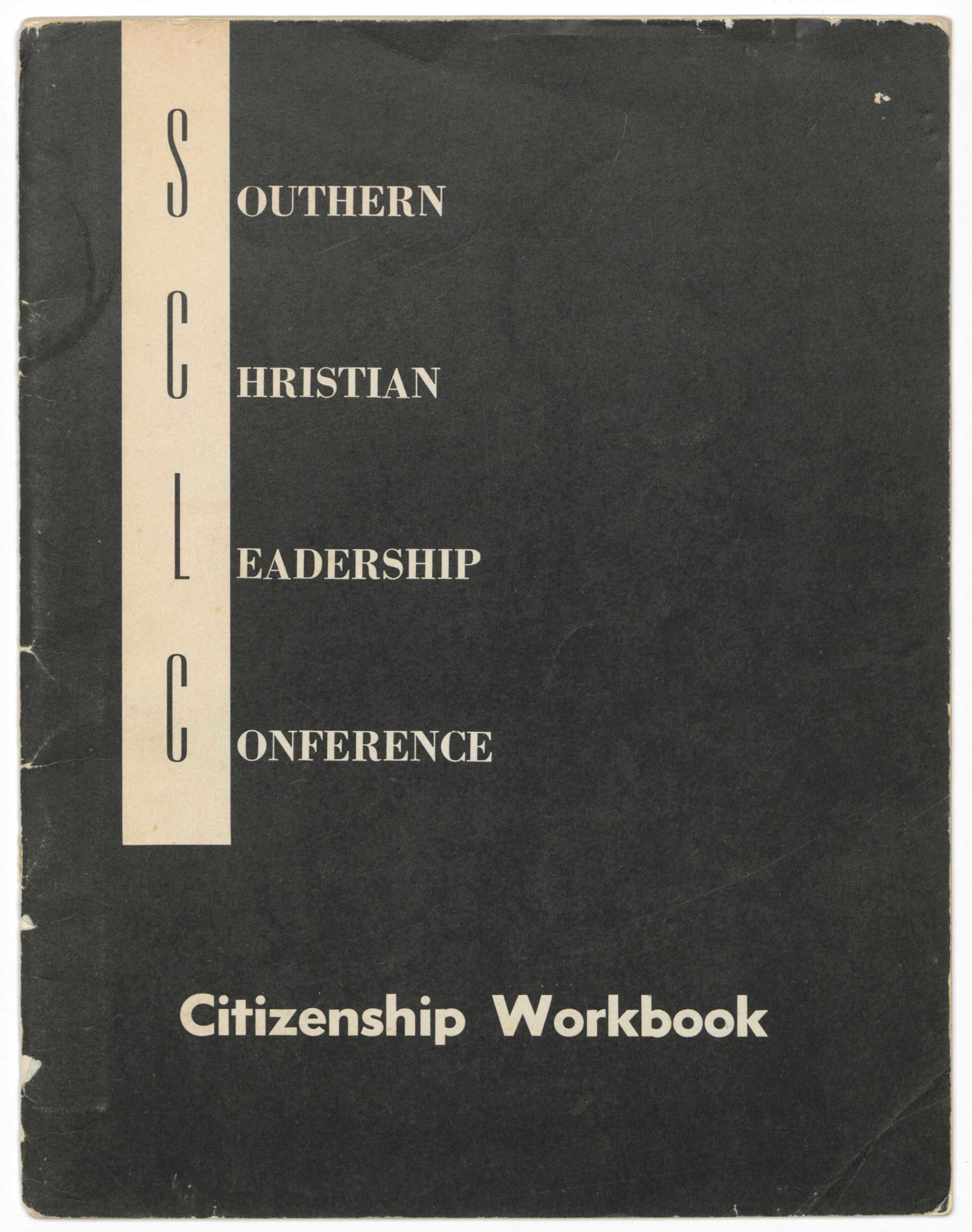 A softback book titled: [Southern Christian Leadership Conference Citizenship Workbook]. The front cover is black with a white vertical block that runs down the proper right side from the top. The block contains the initials: [S / C / L / C] stacked in black. To the right of the block, the initials’ corresponding words are lined up in white type. Together they read: [SOUTHERN / CHRISTIAN / LEADERSHIP / CONFERENCE]. At the bottom of the cover, centered, white type reads: [Citizenship Workbook]. The interior pages, thirty-two in total, are off-white paper with black type and black-and-white images throughout. The inside of the front cover contains information about SCLC Leadership, Citizenship Education Program leadership, and Voter Registration Project leadership. An off-white tab is stuck between front cover and first interior page.  The Foreword contains text from Dr. Martin Luther King, Jr. and a black-and-white image of Dr. King, Dr. C. O. Simpkins and Robert F. Kennedy. There is an envelope adhered between the last interior page and back cover. The back cover has a white rectangular box, centered, with black type that reads: [This book belongs to:]. The rest of the box contains fill in the blanks that include: [Name / Address / City   County / State]. Handwritten in pencil in the "Name" blank is: [Kitt].