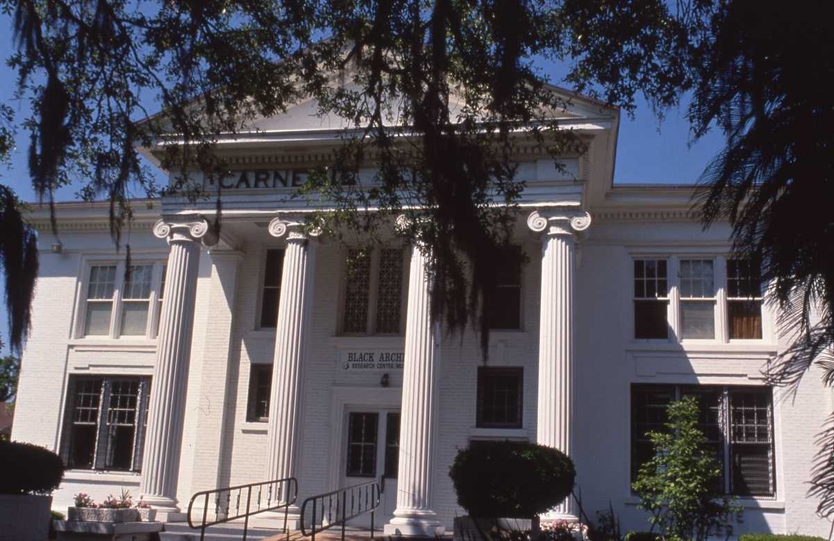 Historic white building with tall columns and a sign for the Black Archives & Research Center.