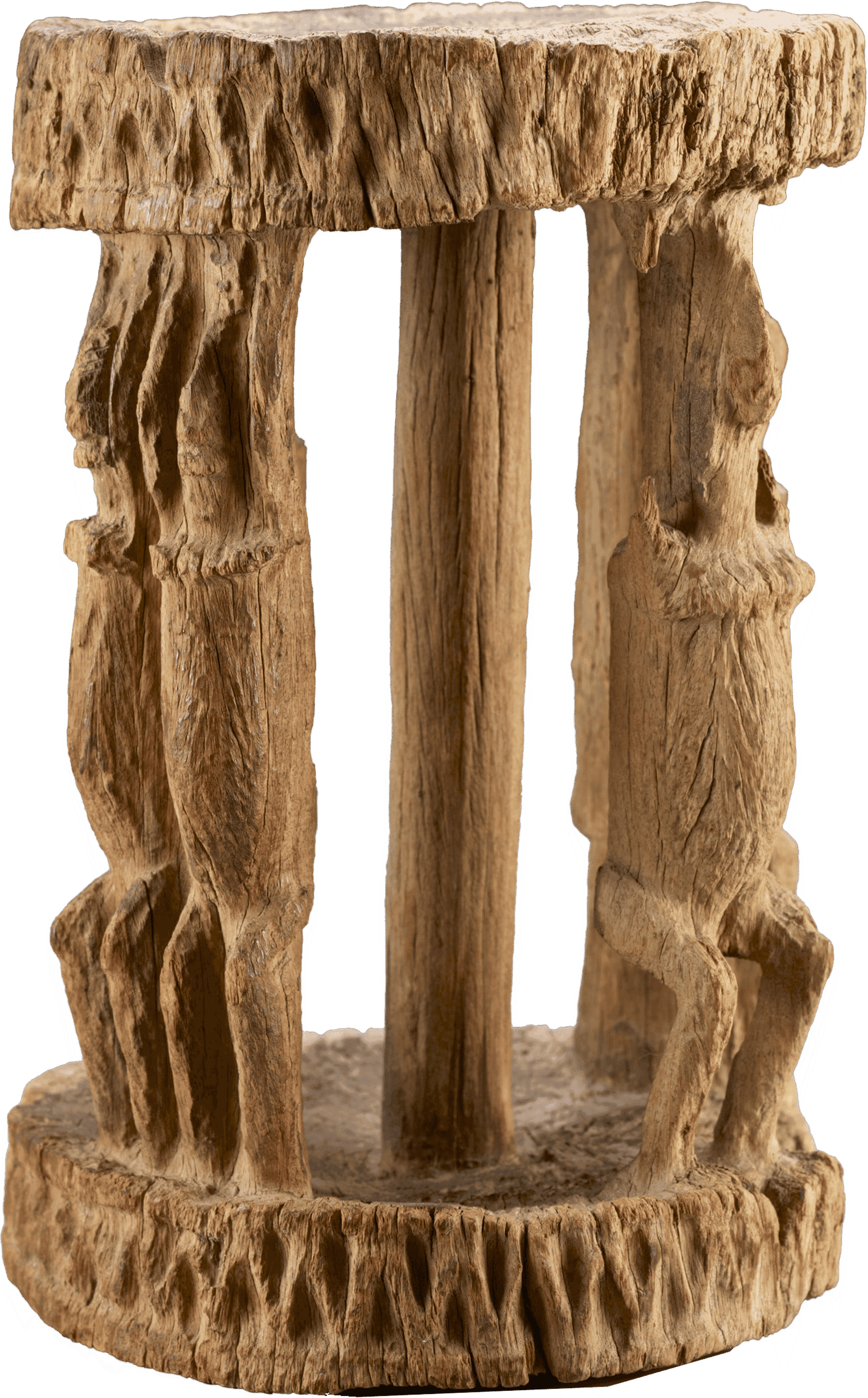 A wooden carved stool of three figures holding the top of the stool and carved patten into ends.