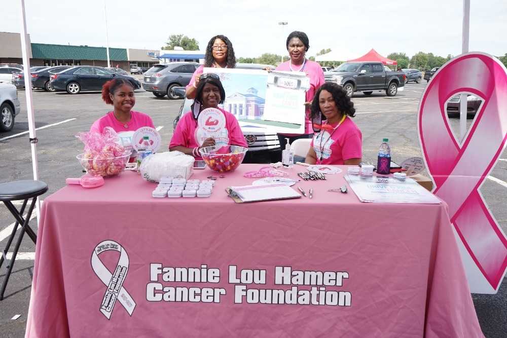 Photograph of women at the Fannie Lou Hamer Cancer Foundation table