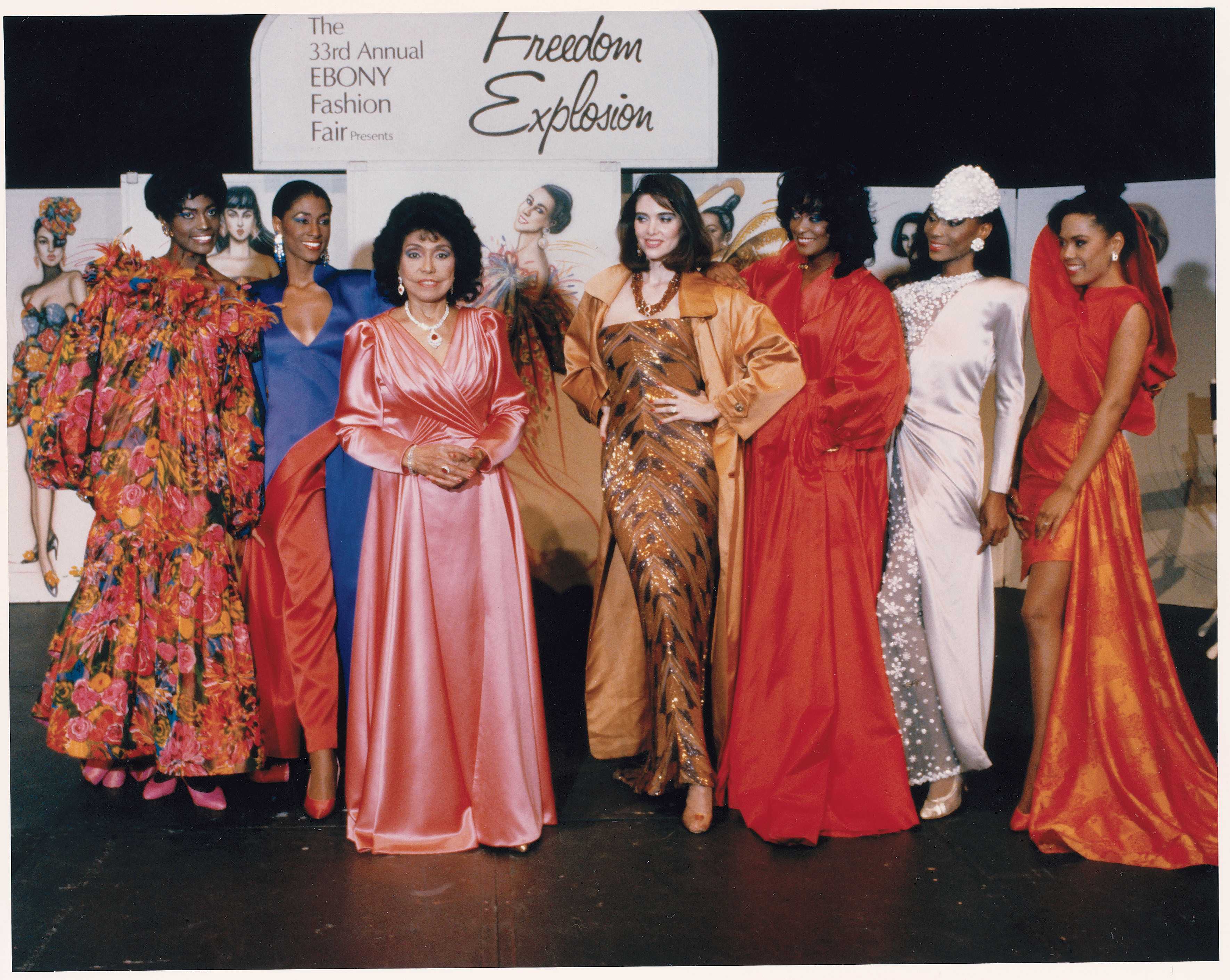 Photograph of Eunice Walker Johnson and other models dressed in formal wear