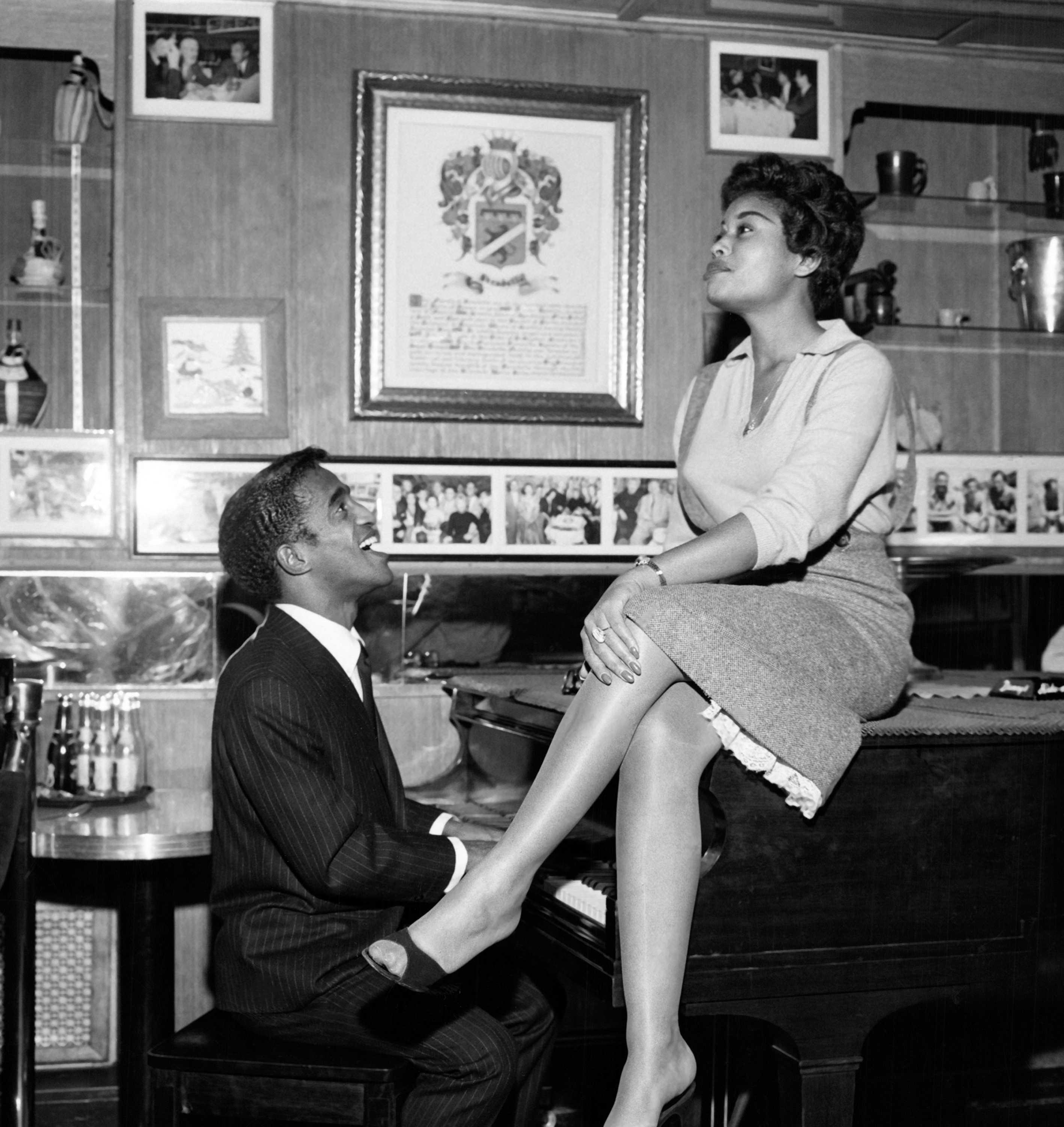 Black and white photograph of Sammy Davis Jr. and Abbey Lincoln singing a duet