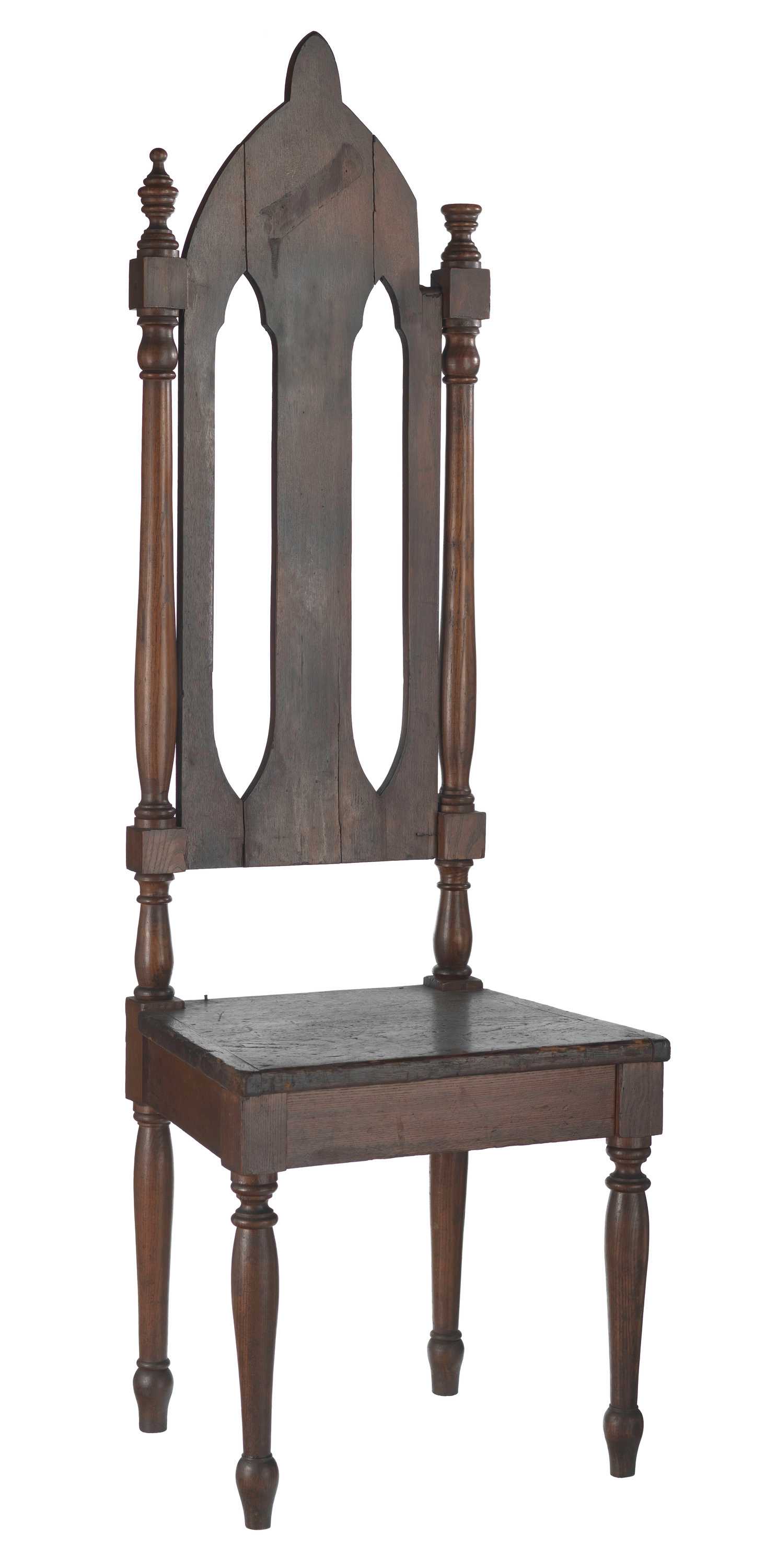 A high backed wooden chair used at the Prince Hall Masonic Lodge of Massachusetts.