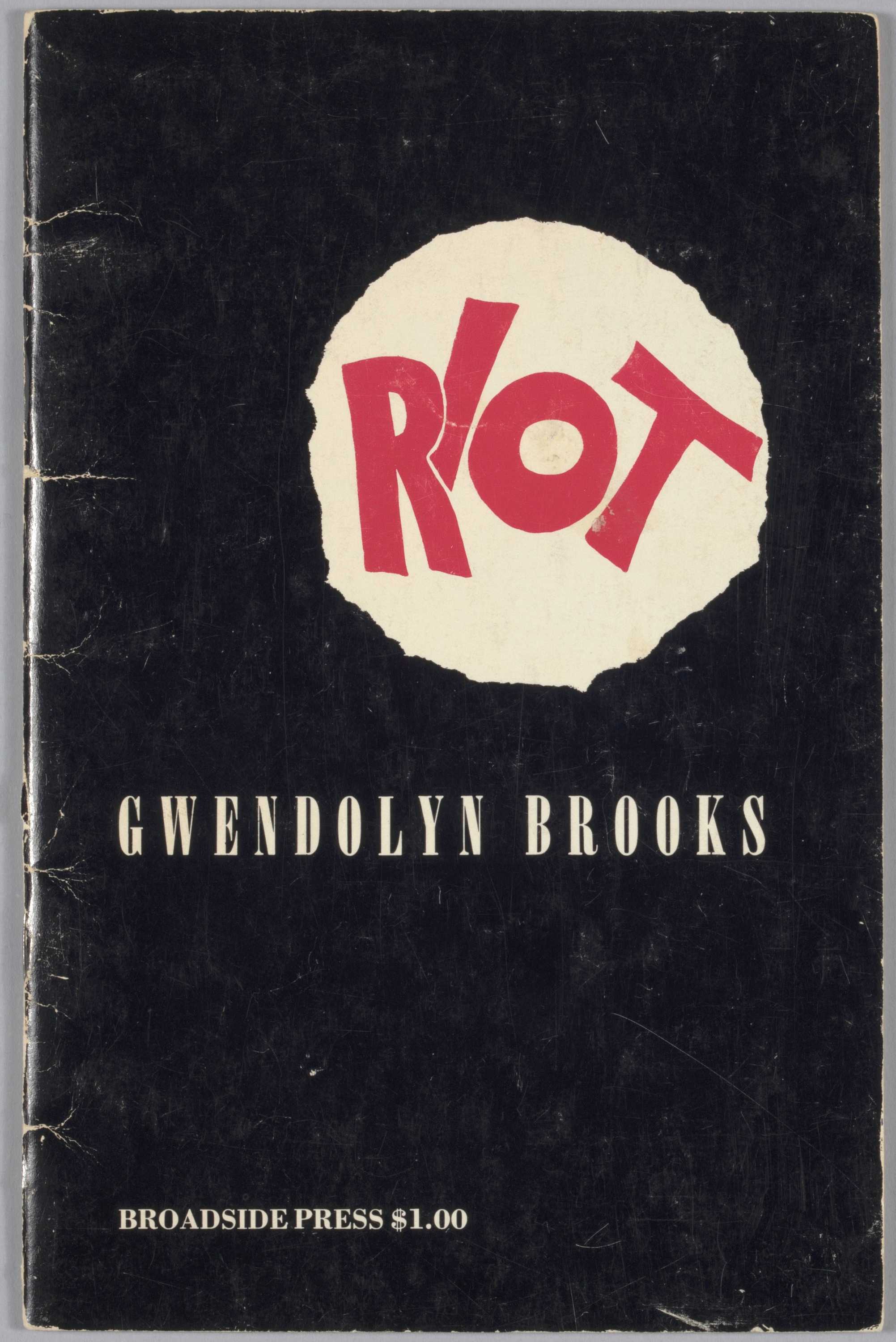 This is a paperback volume of poetry with black cover and the word "RIOT" in red san-serif typeface within a white irregular circle.