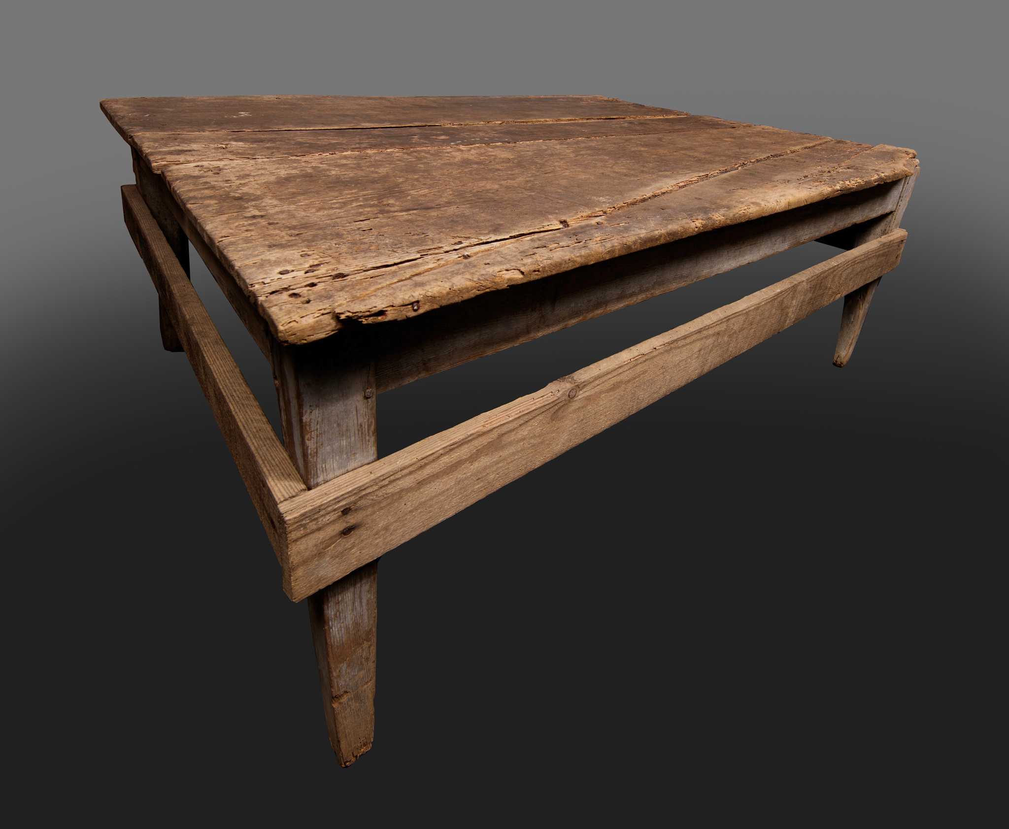 A wooden table used at Cedar Grove plantation in Edgefield County, South Carolina. The four-legged table is made of yellow pine. The table top consists of three (3) machine-milled boards finished with scrub plane on the underside and with a cabinetmaker's plane on the top side. The boards are joined with full-length tongue and groove joints, and the top is nailed to the apron. The four legs are a tapered square shape and are attached to the apron with a half-haunched offset split double mortise and tenon construction. The stretchers nailed around the outside of the legs are a later addition and are made from red oak.