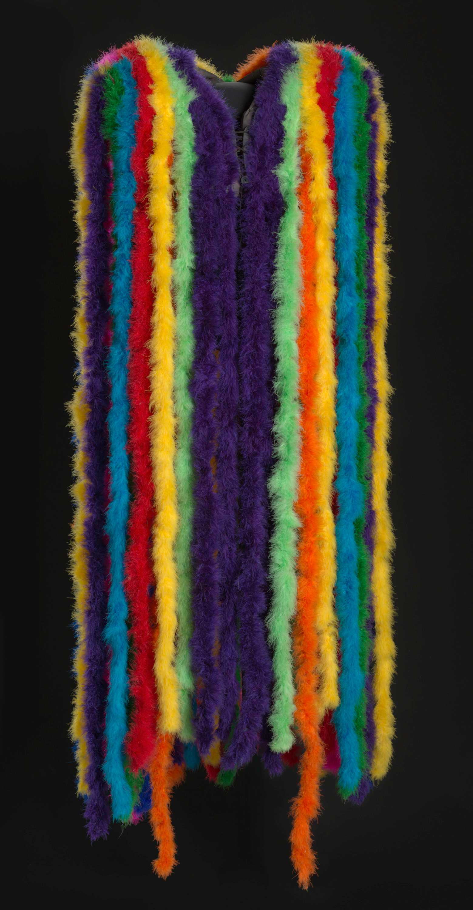 Multi-colored feather boa cape on dark background