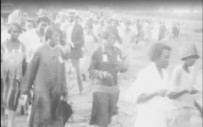 A still black and white image from the Solomon Sir Jones Film of the Juneteenth Parade Beaumont.