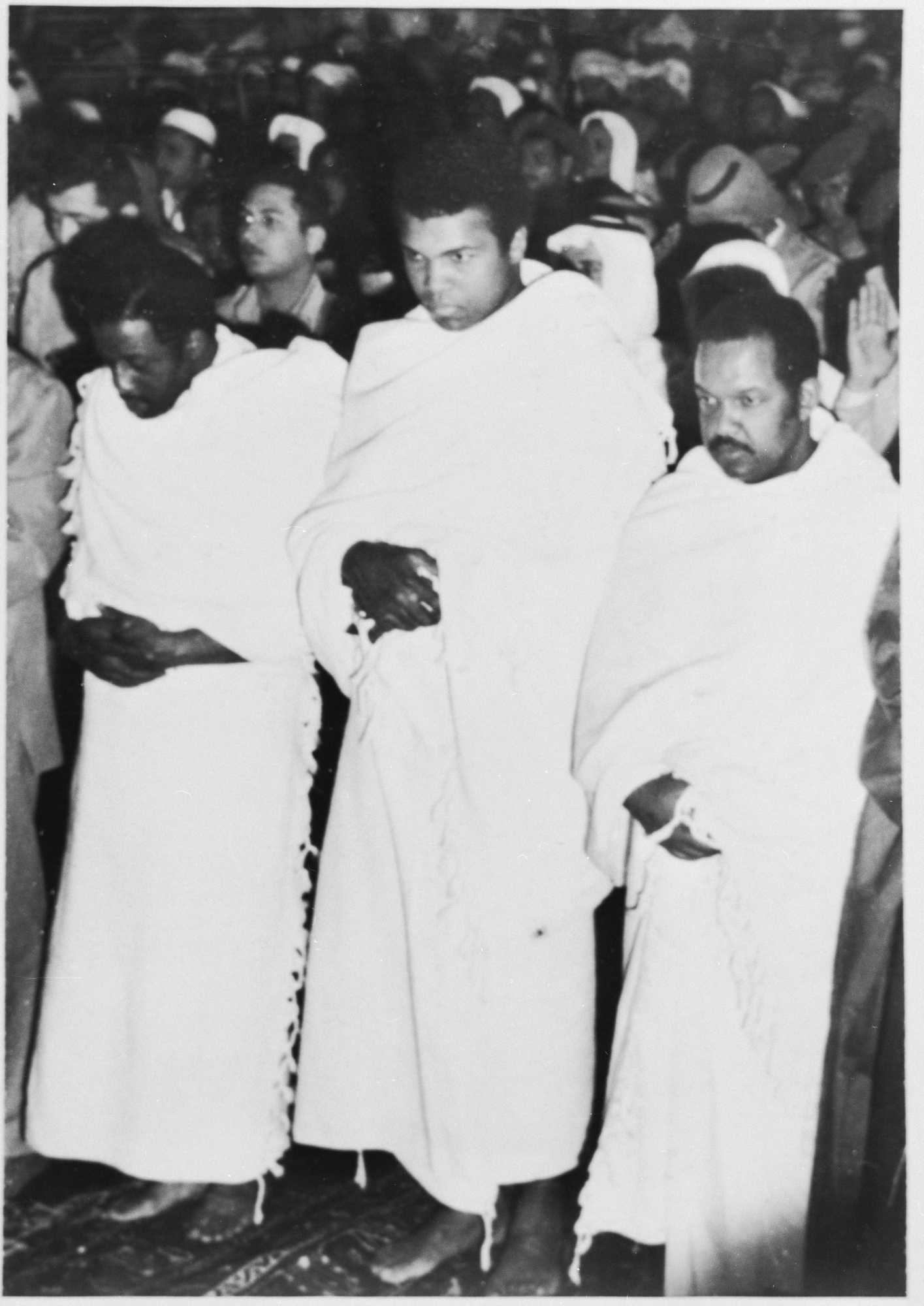 Black and White photograph of three men at Mecca