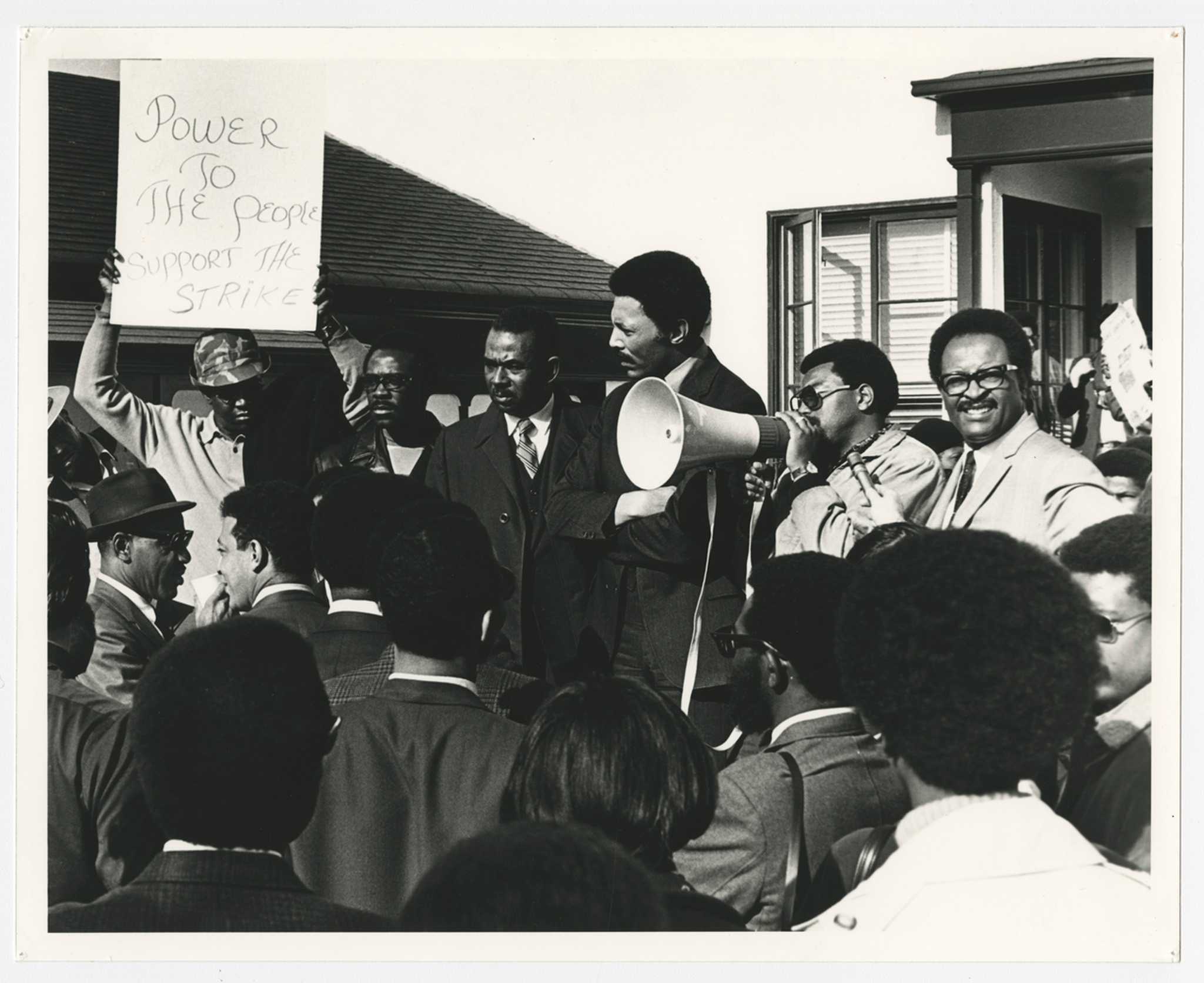 Protesters with bullhorn and sign that reads, "Power to the people -- support the strike," San Francisco State College strike