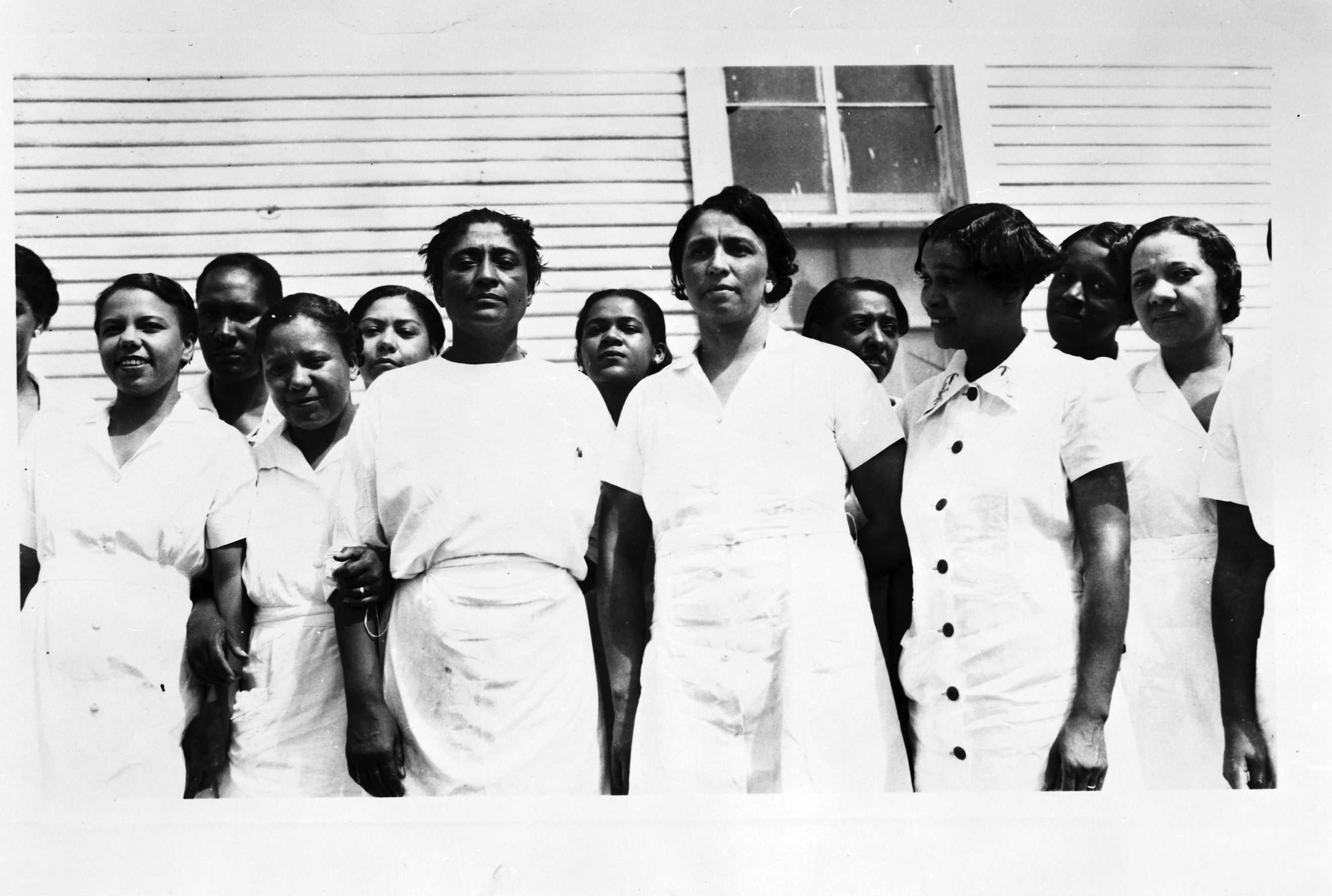 Black and white photograph of Dorothy Ferebee and the Mississippi Health Project female staff dressed in medical uniforms