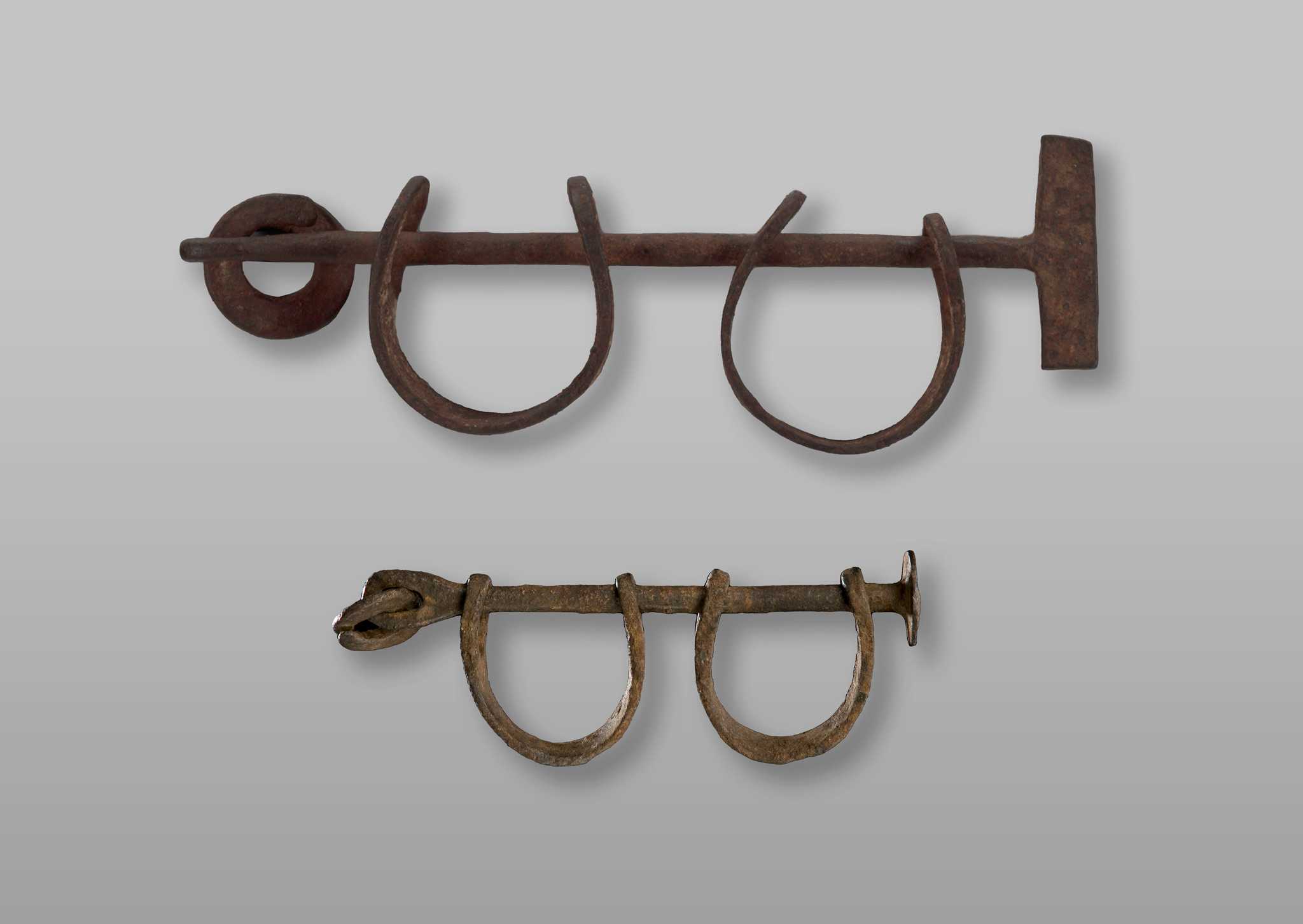 Adult and child shackles photographed in the case