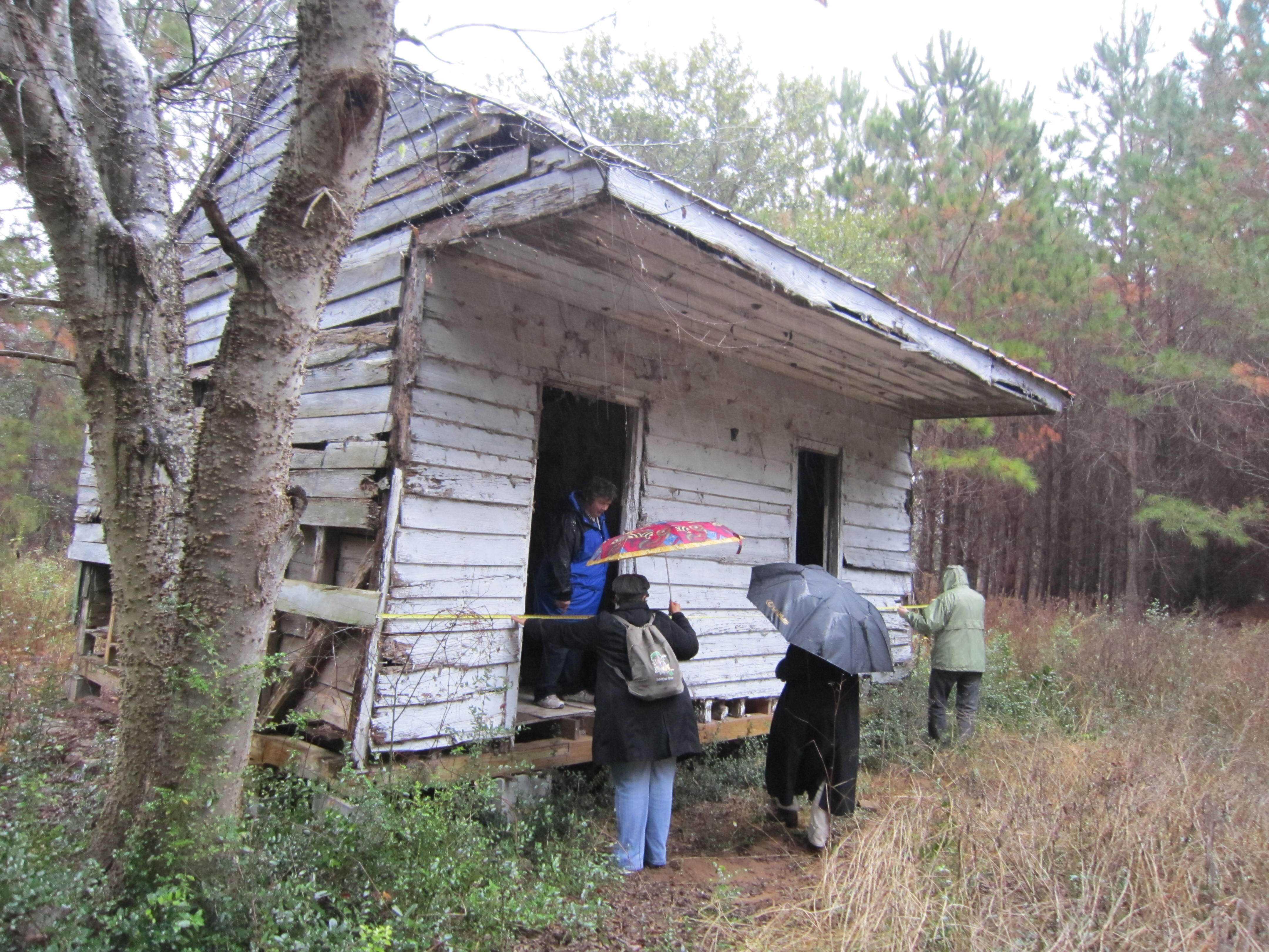 Photograph of teams in front of Edisto Island cabin in South Carolina